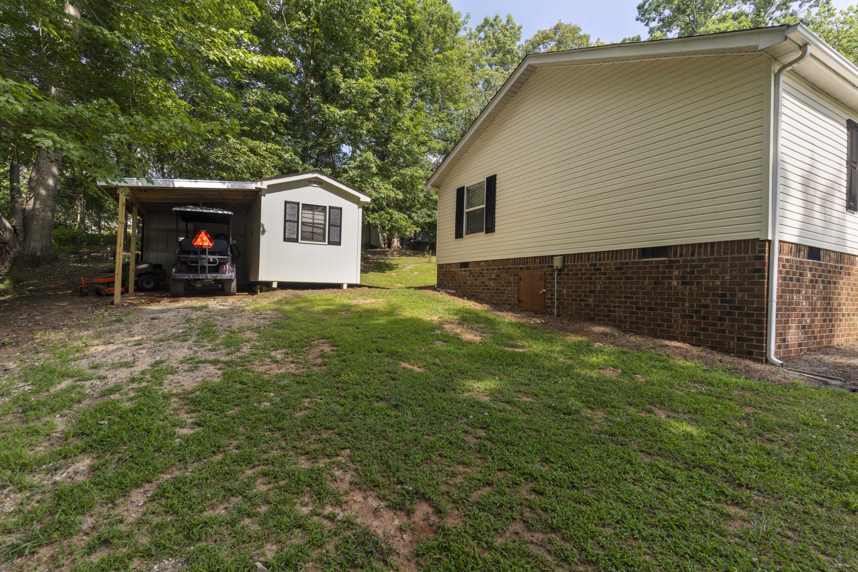 391 Cool Branch Road Penhook, VA 24137 - Photo 9 of 54 a view of a house with a yard