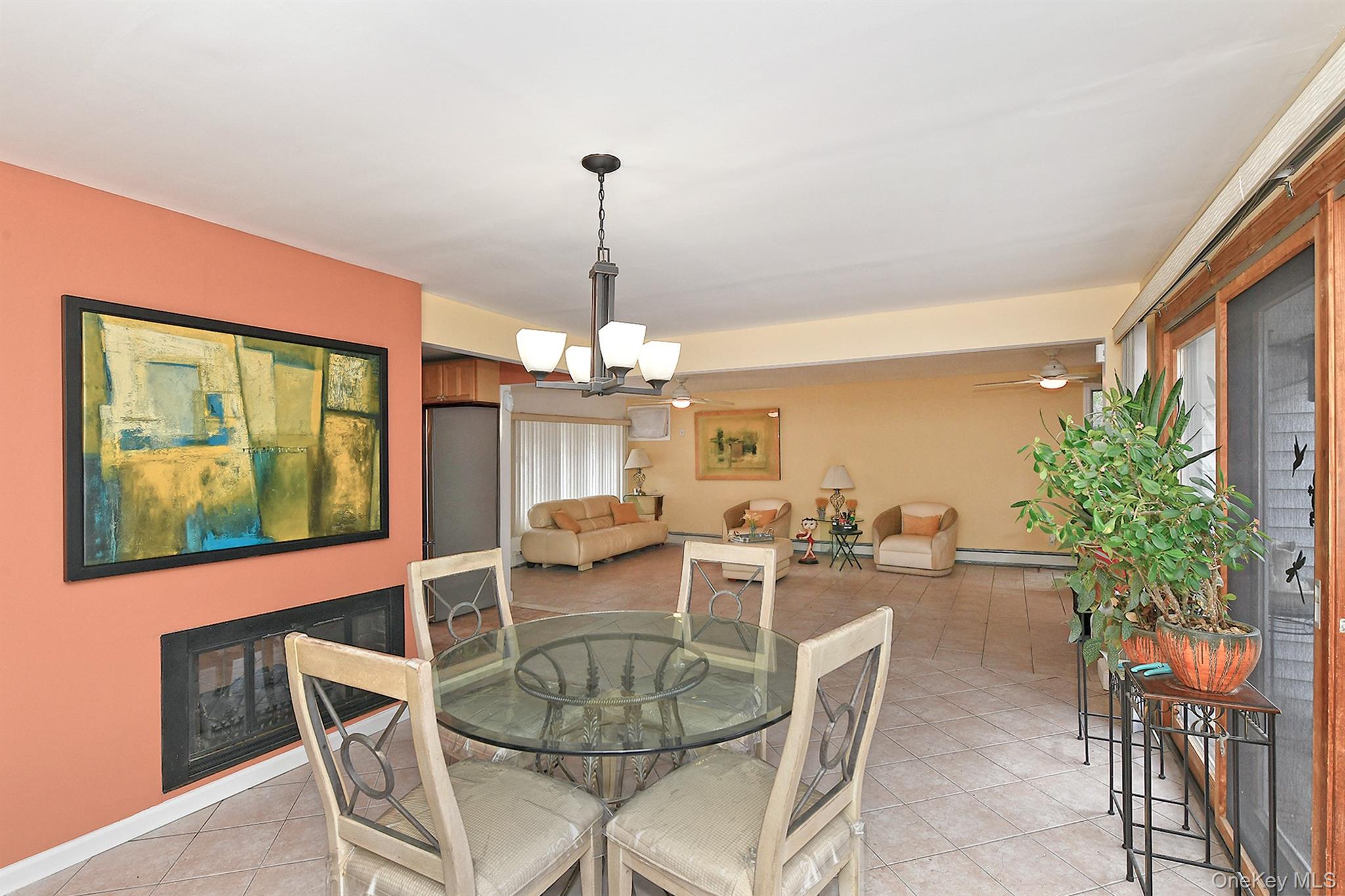156 Farmedge Road Levittown, NY 11756 - Photo 11 of 22 a dining room with furniture a chandelier and window