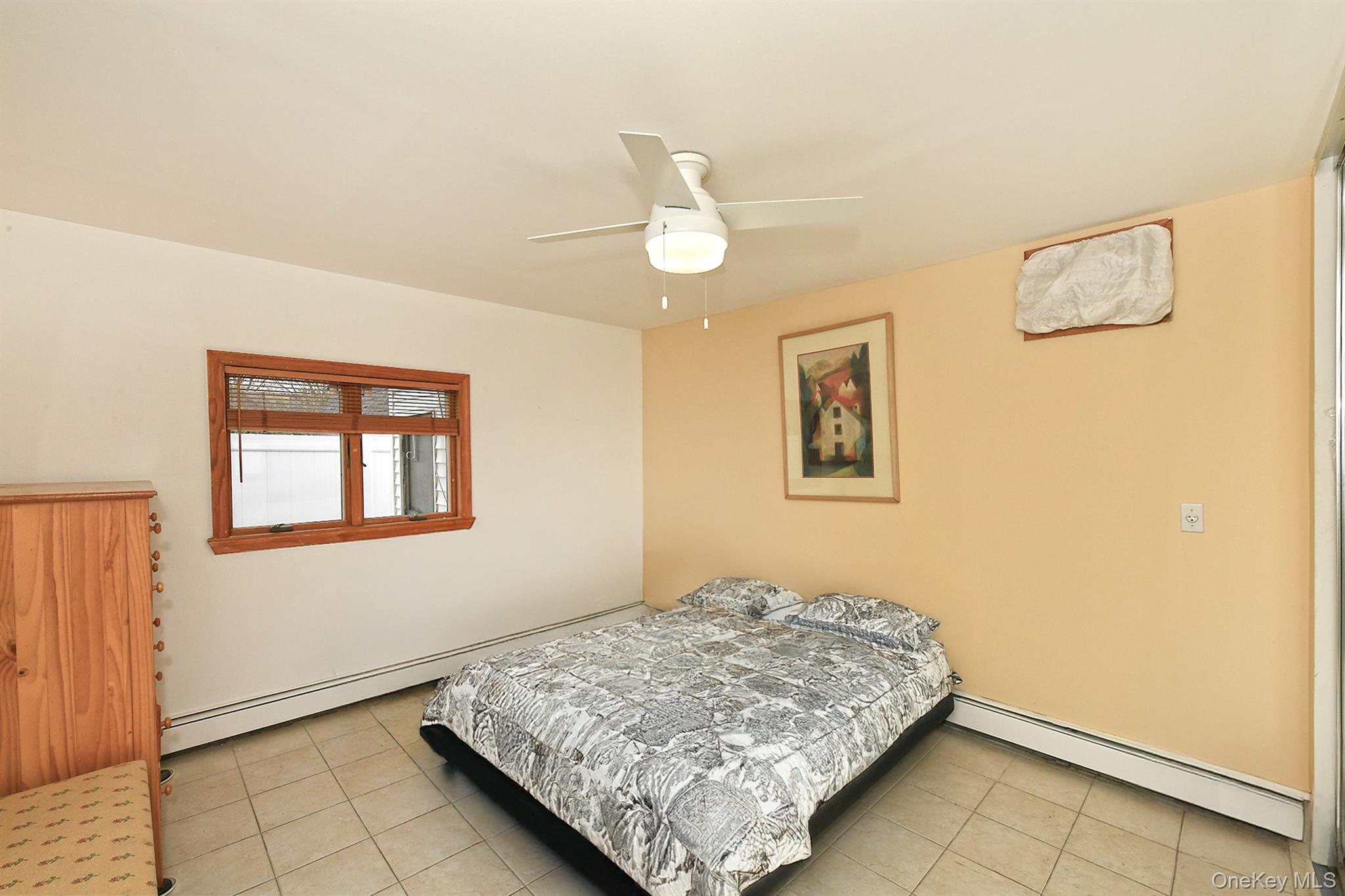 156 Farmedge Road Levittown, NY 11756 - Photo 12 of 22 a bedroom with bed and window