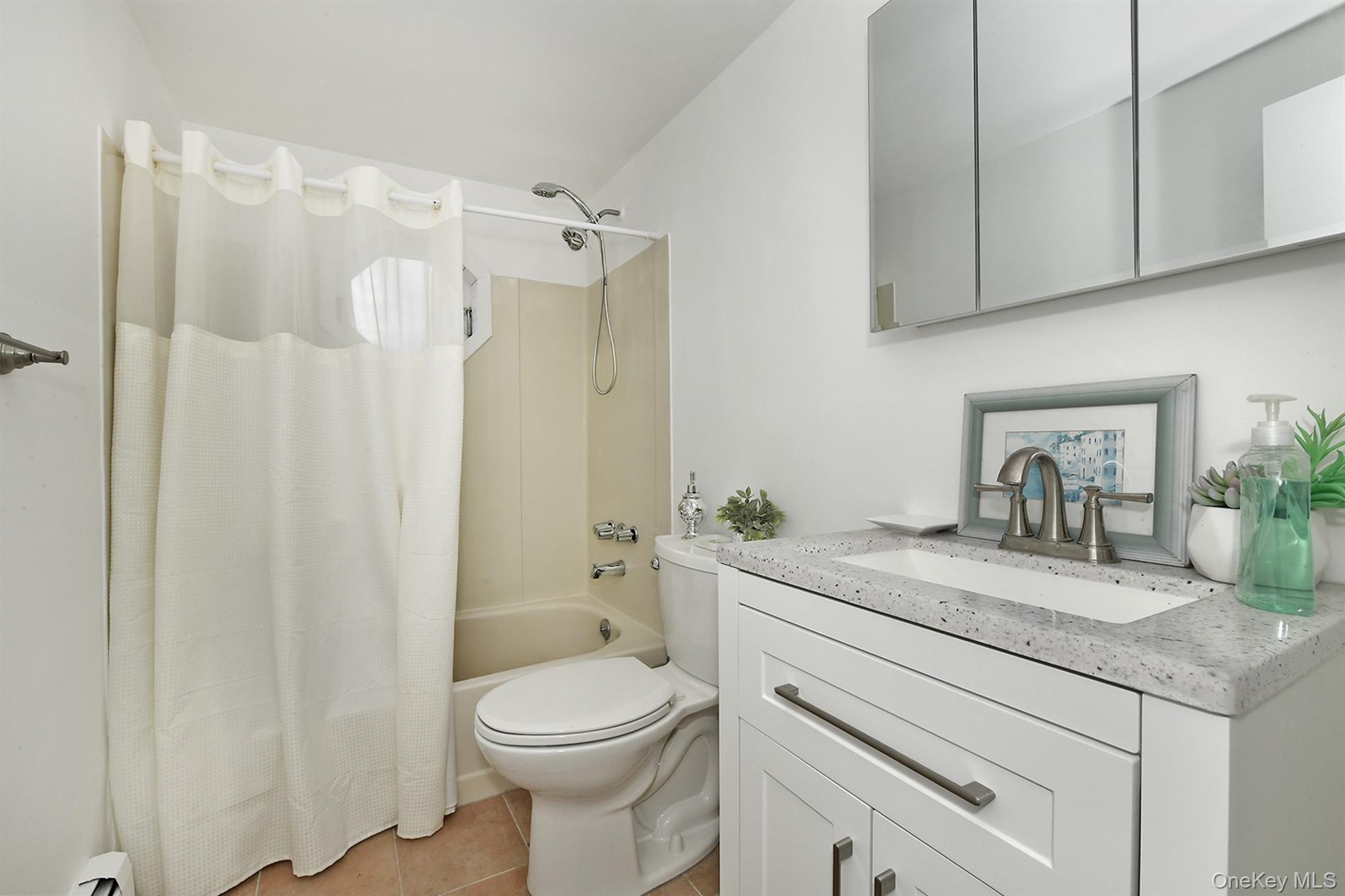 156 Farmedge Road Levittown, NY 11756 - Photo 16 of 22 a bathroom with a granite countertop sink toilet and shower
