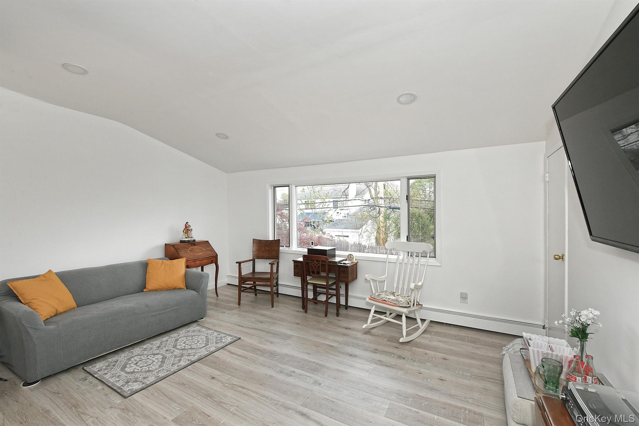 156 Farmedge Road Levittown, NY 11756 - Photo 17 of 22 a living room with furniture and a window