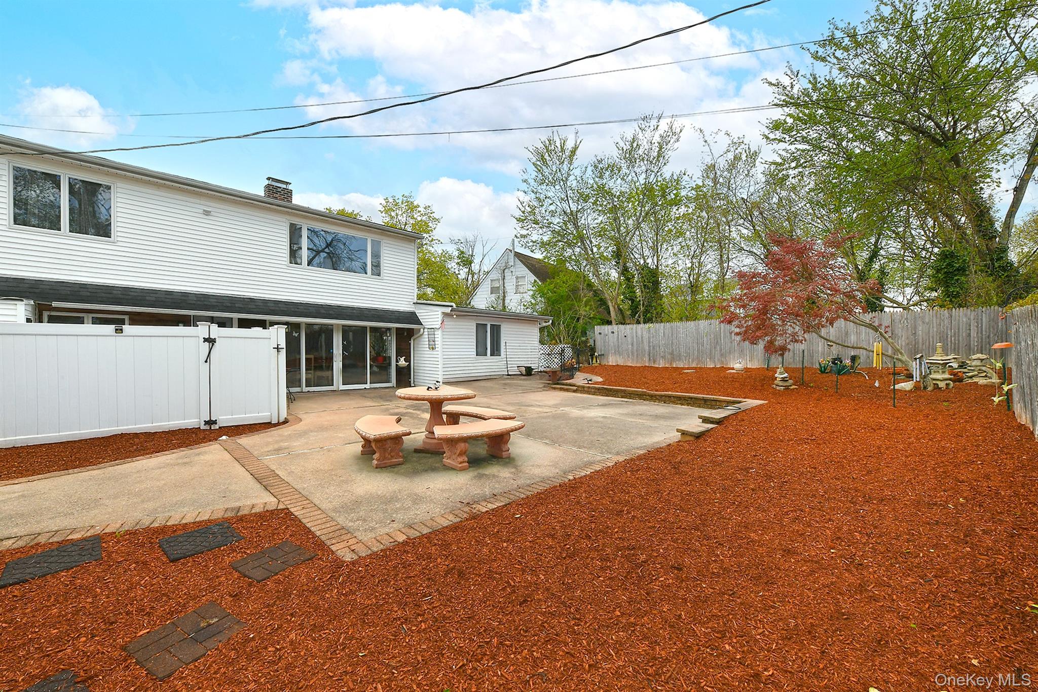 156 Farmedge Road Levittown, NY 11756 - Photo 21 of 22 a view of a white house with a swimming pool