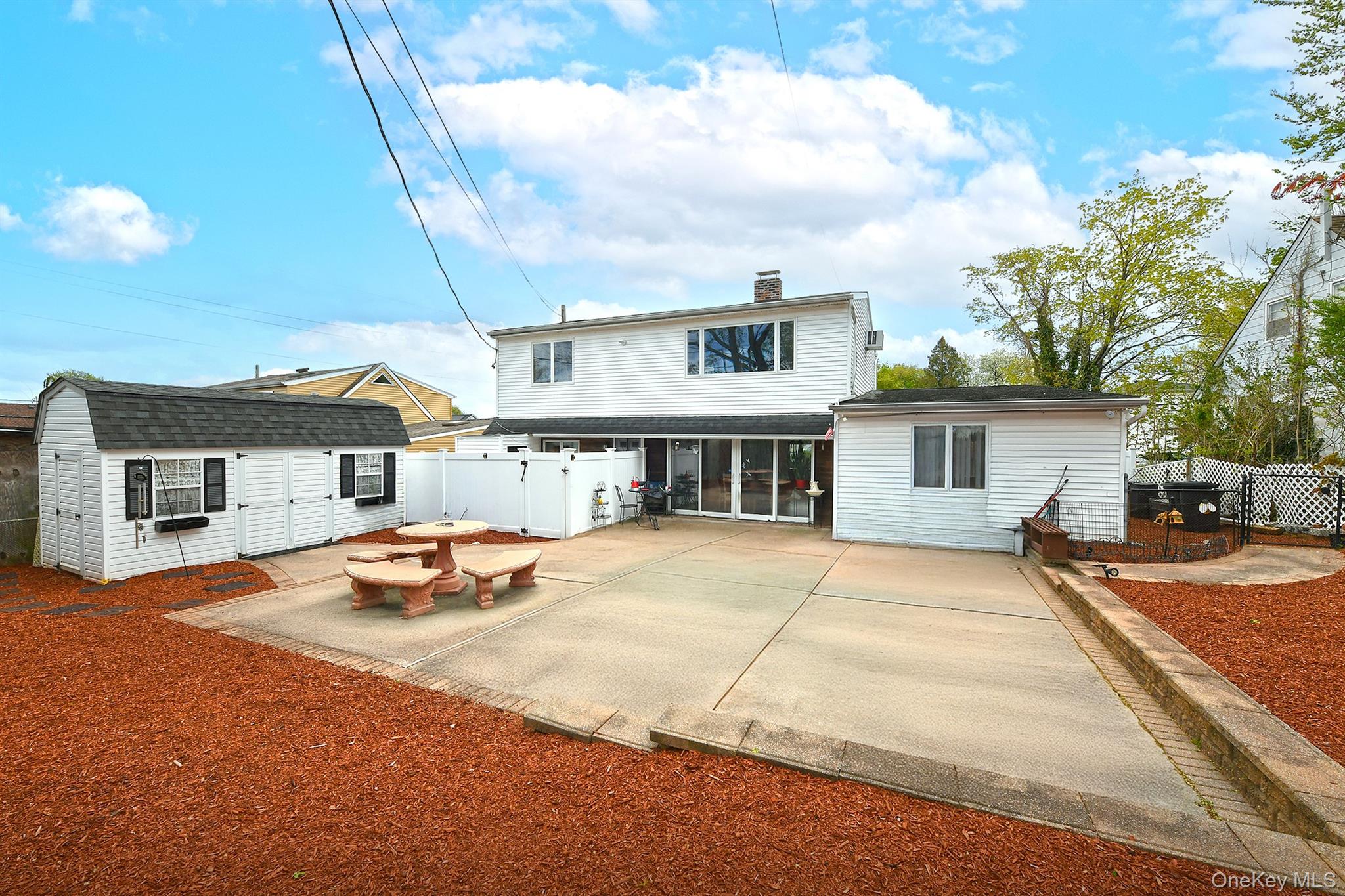 156 Farmedge Road Levittown, NY 11756 - Photo 22 of 22 a view of a house with wooden floor and roof