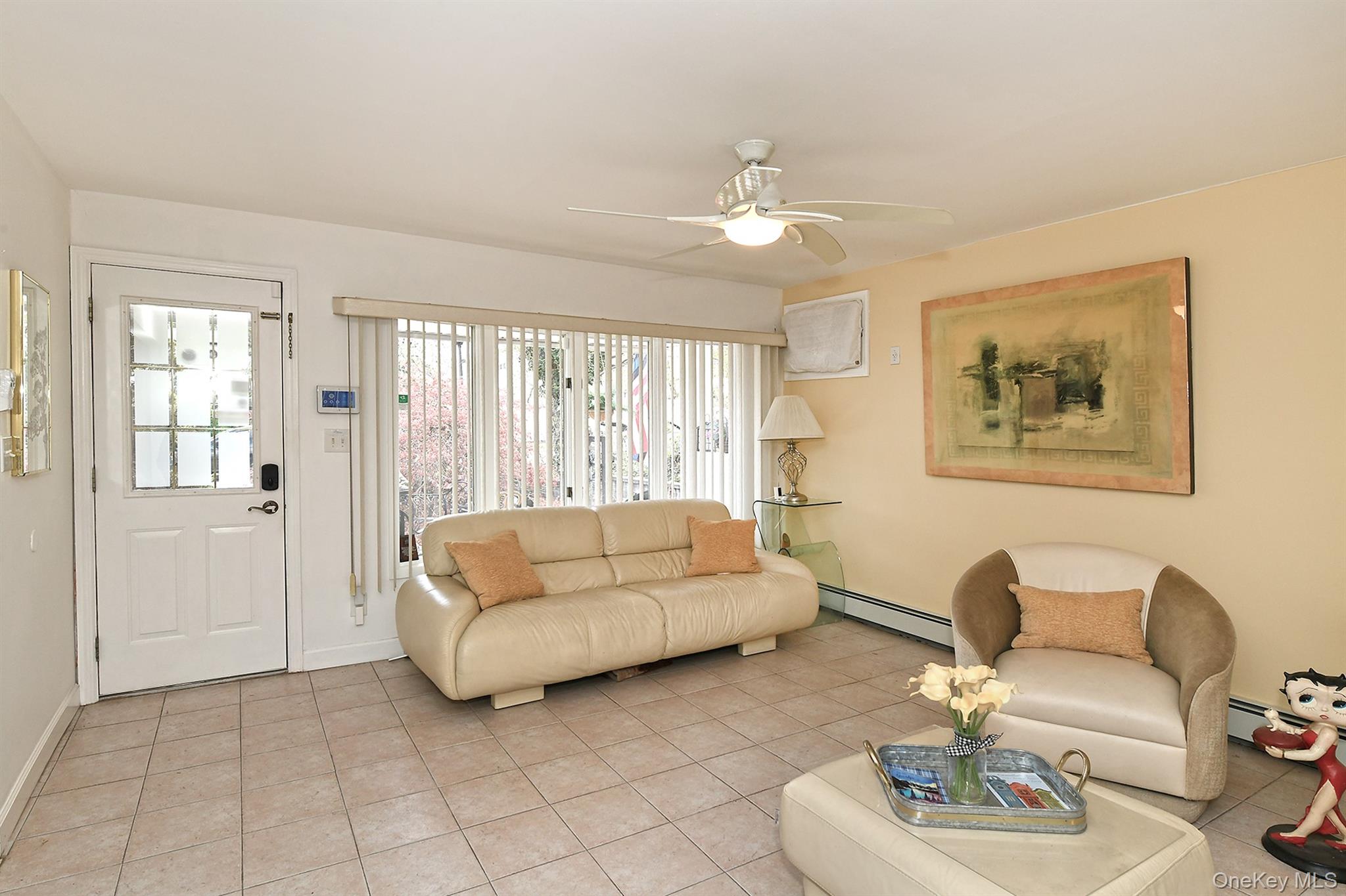 156 Farmedge Road Levittown, NY 11756 - Photo 3 of 22 a living room with furniture and a large window