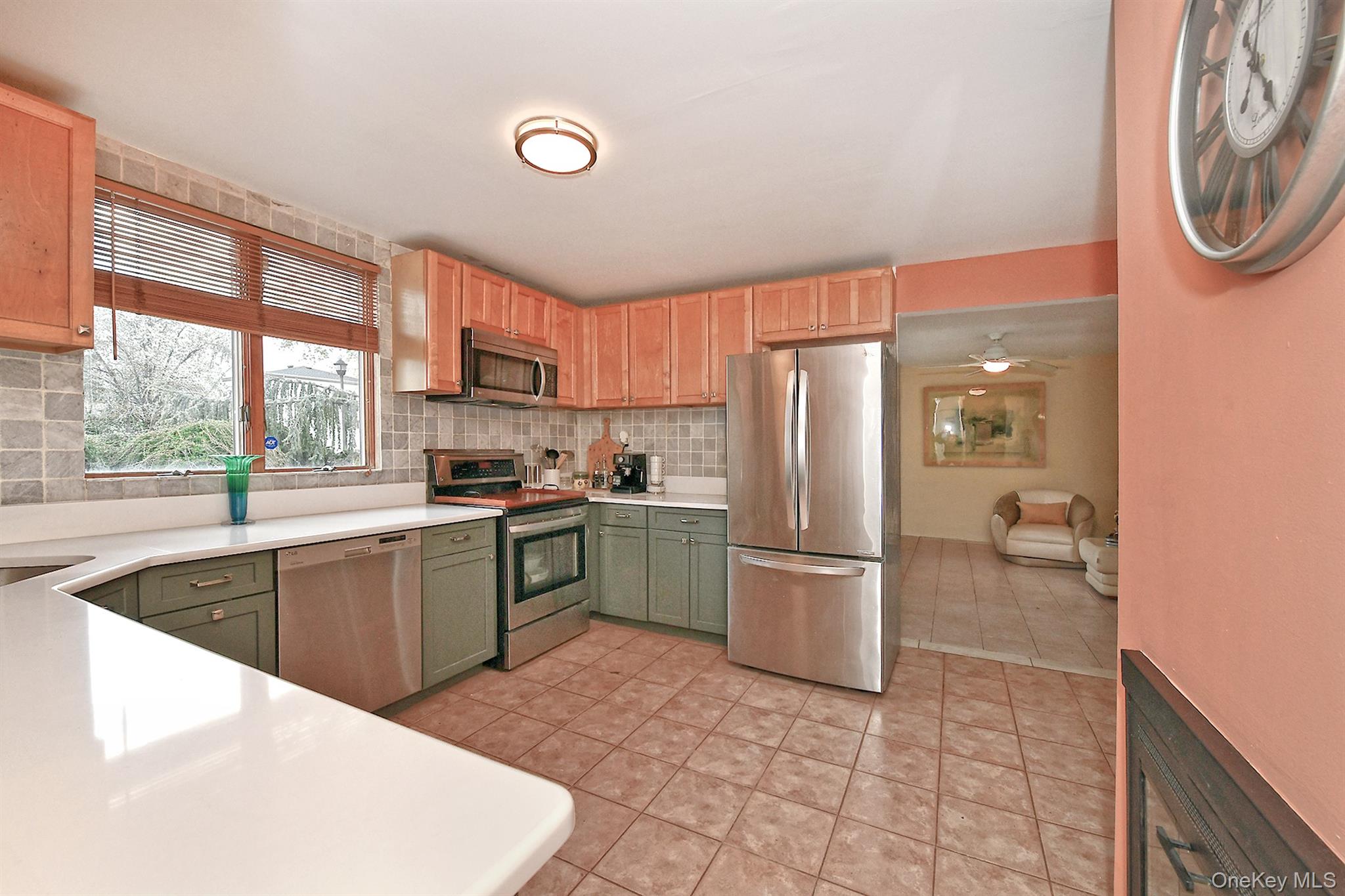 156 Farmedge Road Levittown, NY 11756 - Photo 10 of 22 a kitchen with a refrigerator and a sink