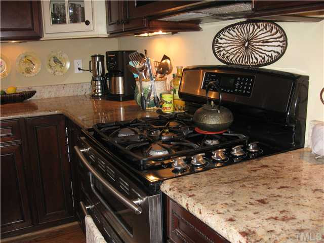 706 Tower Street Raleigh, NC 27605 - Photo 11 of 23 Gorgeous granite...and gas range.