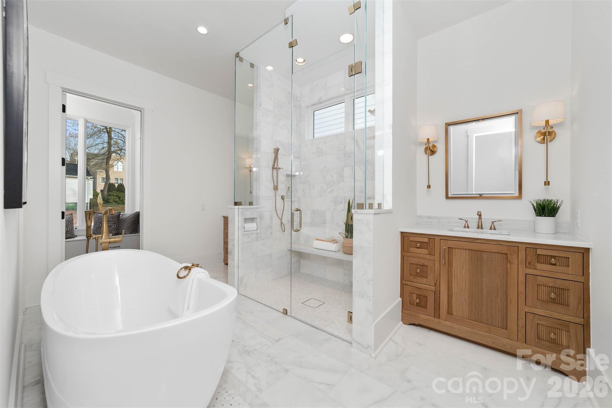 216 Walnut Street Davidson, NC 28036 - Photo 19 of 48 a large spacious bathroom with a tub sink shower and mirror