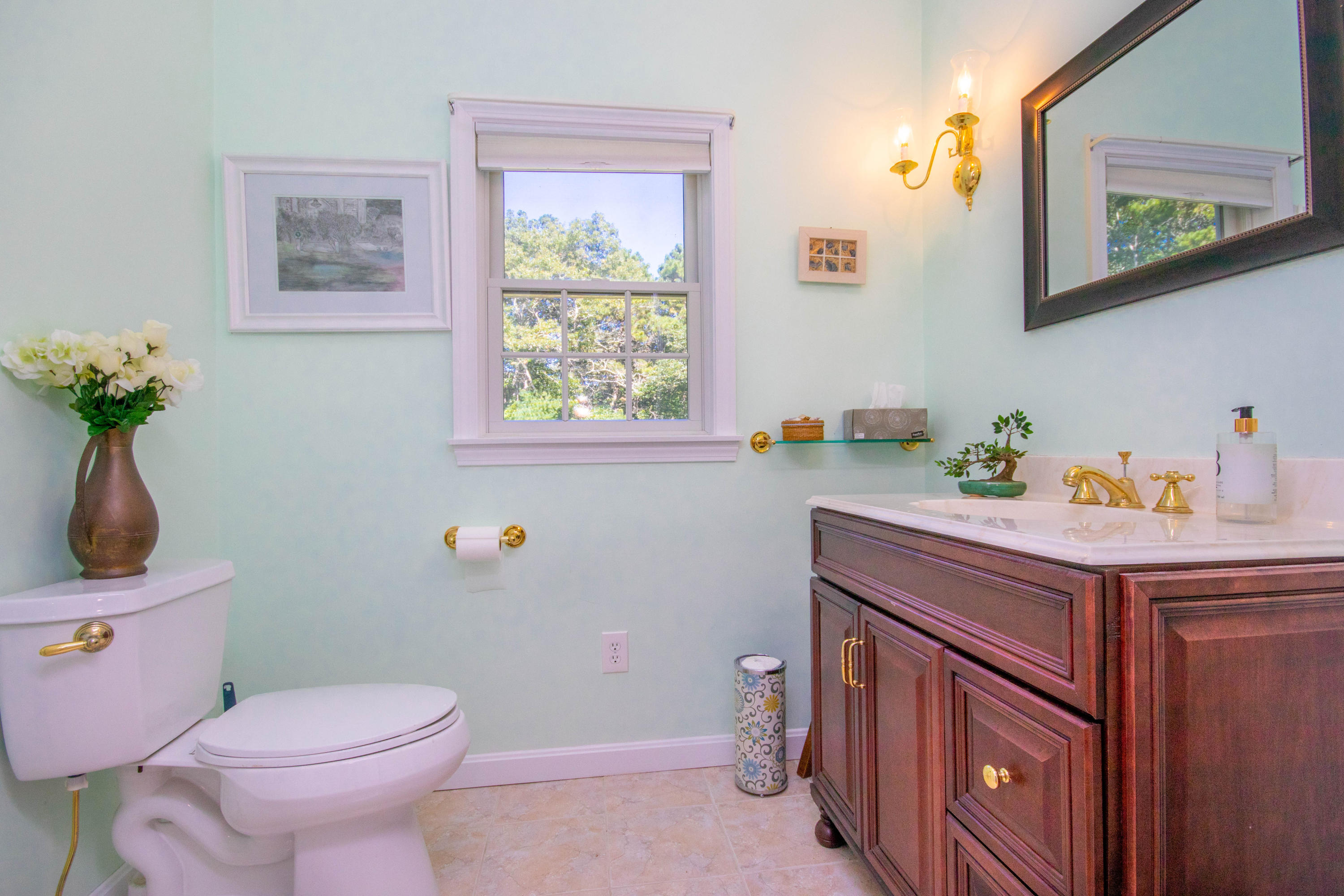 52 Lovells Road Cotuit, MA 02635 - Photo 23 of 51 a bathroom with a sink a toilet and a window