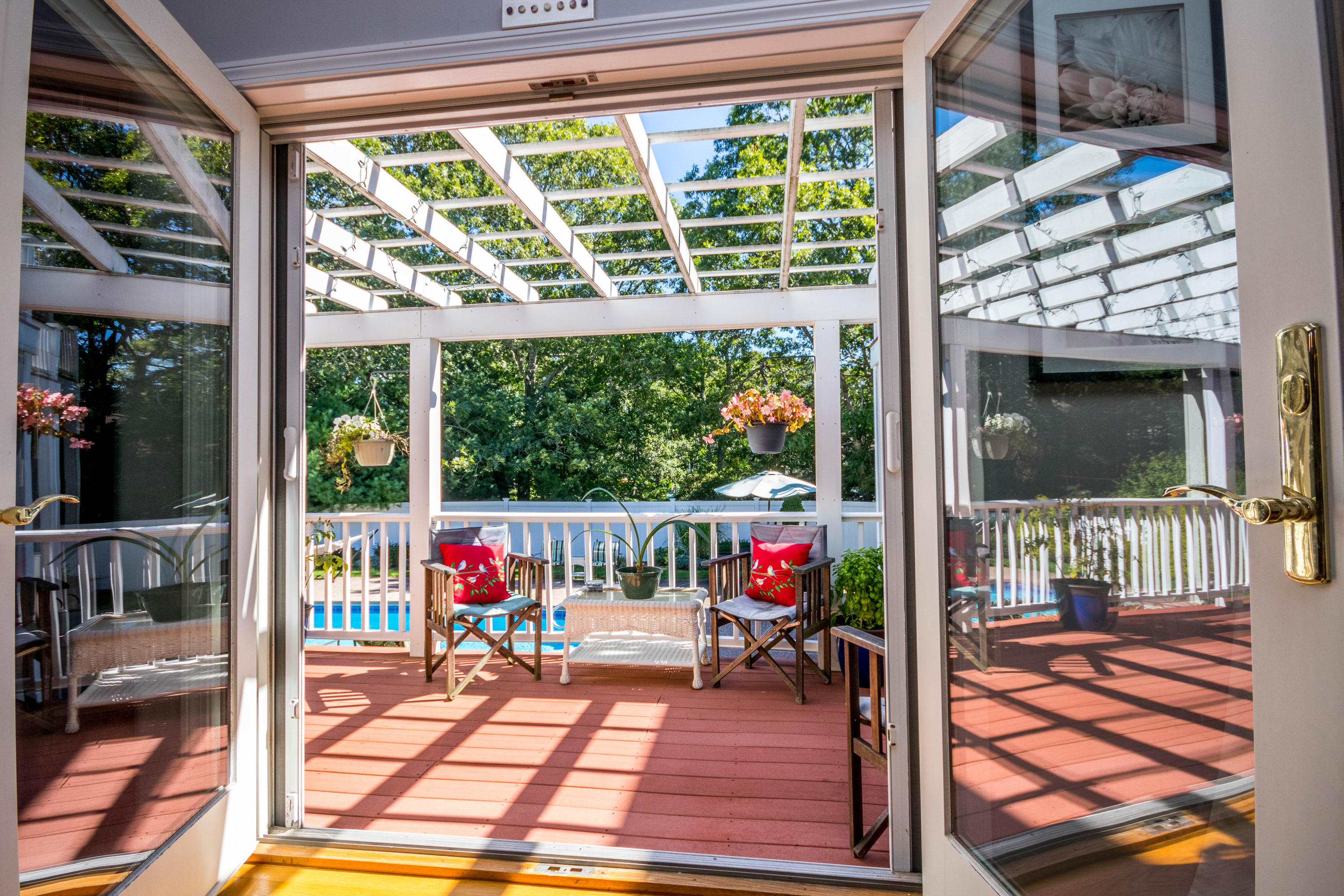 52 Lovells Road Cotuit, MA 02635 - Photo 8 of 51 a living room filled with furniture and a floor to ceiling window