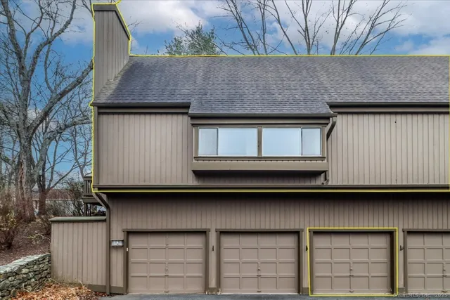 a front view of a house with a wooden fence