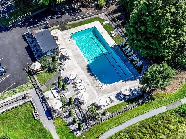 an aerial view of a house a yard and outdoor seating