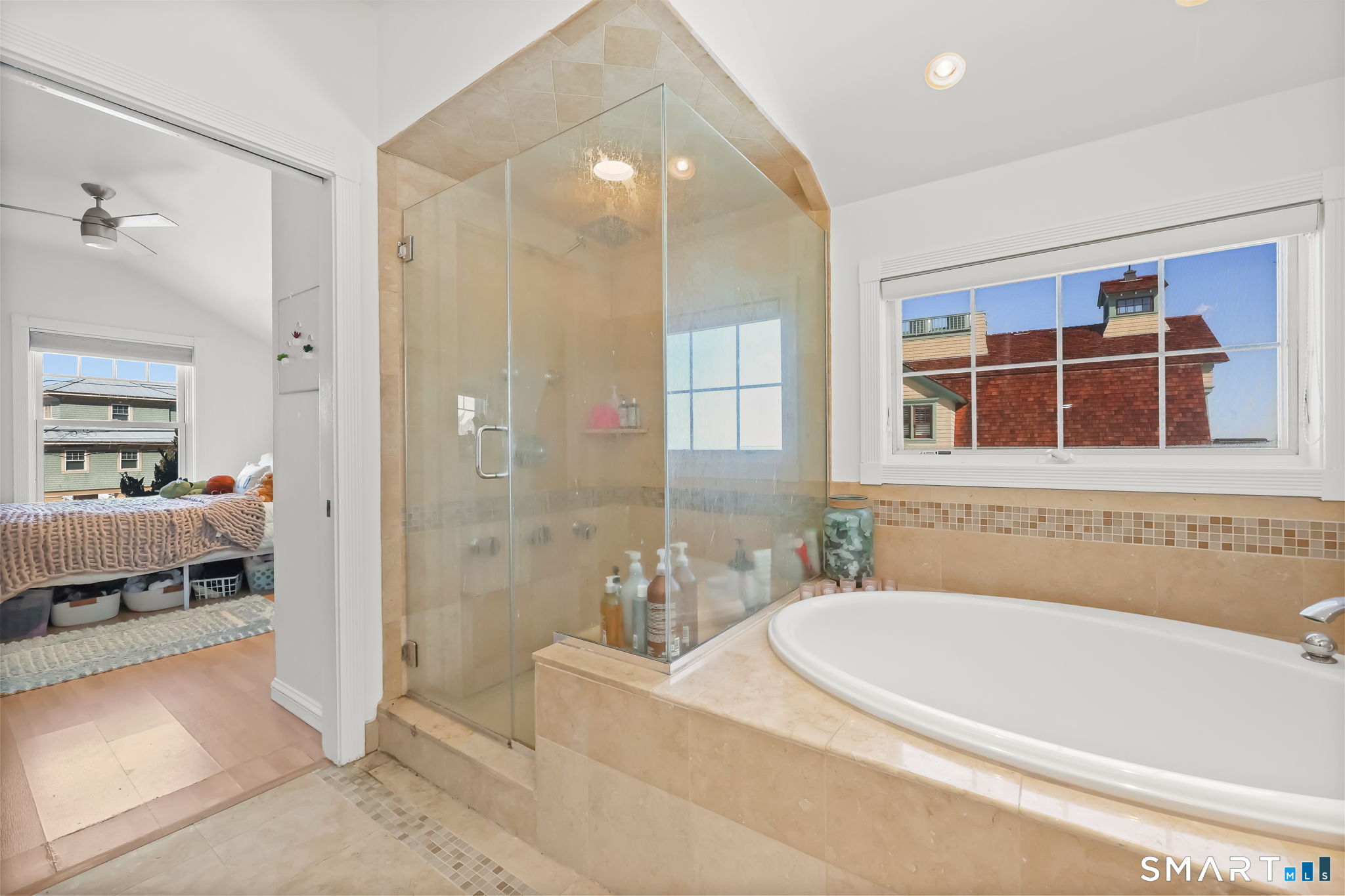 1895 Fairfield Beach Road Fairfield, CT 06824 - Photo 11 of 18 a bathroom with a bathtub and a shower