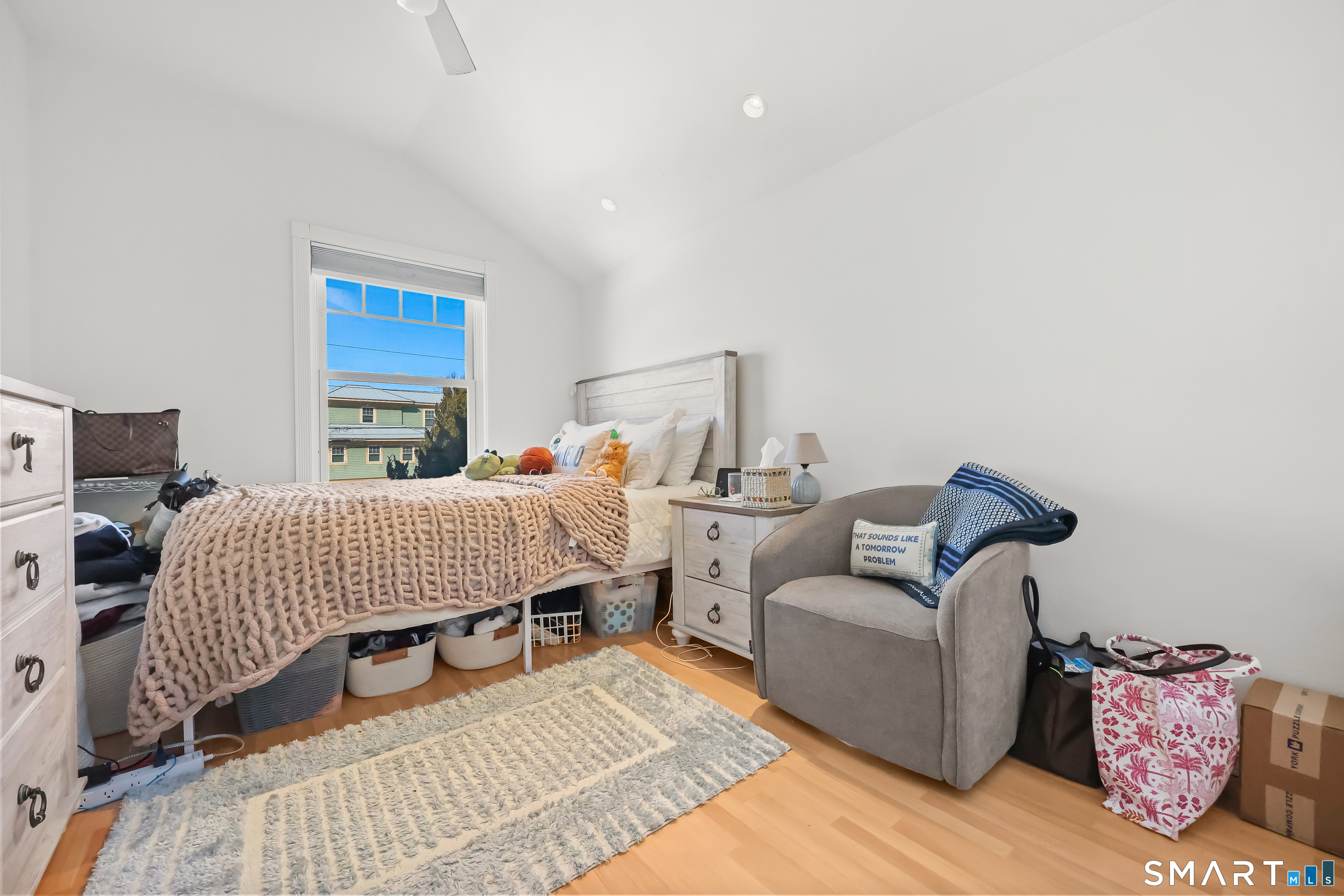 1895 Fairfield Beach Road Fairfield, CT 06824 - Photo 12 of 18 a bedroom with furniture and a couch