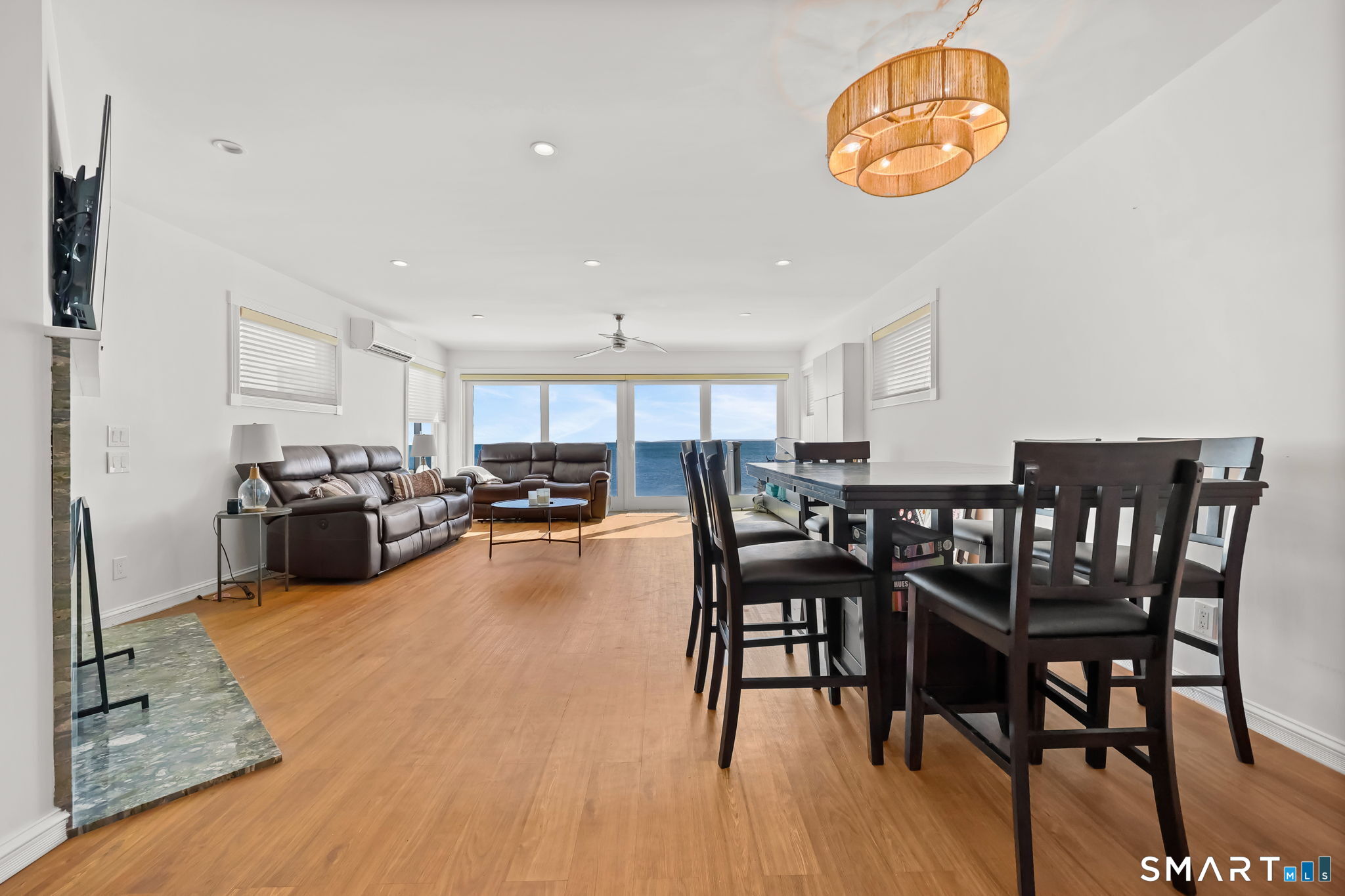 1895 Fairfield Beach Road Fairfield, CT 06824 - Photo 3 of 18 a view of a dining room with furniture