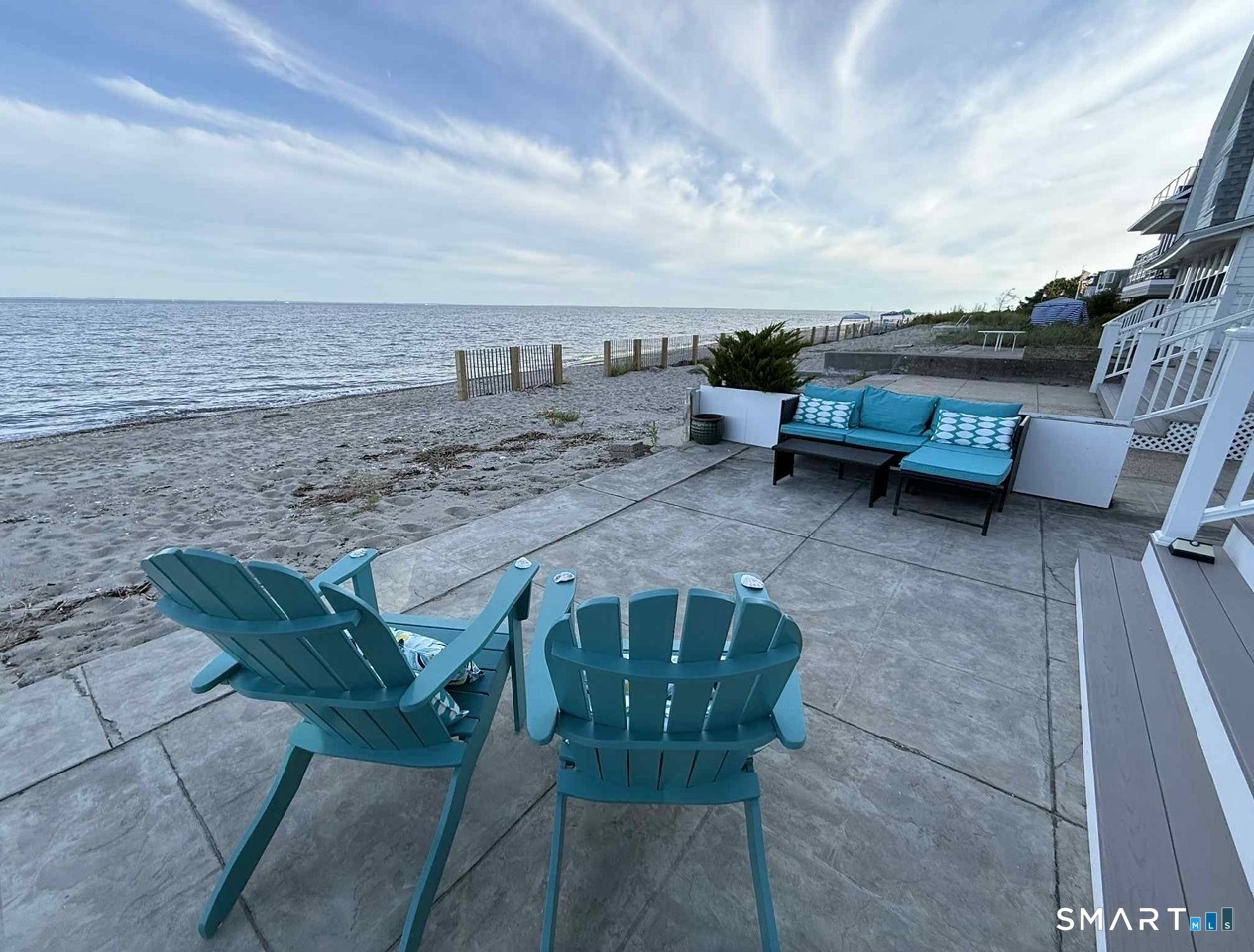 1895 Fairfield Beach Road Fairfield, CT 06824 - Photo 4 of 18 a view of a terrace with chairs
