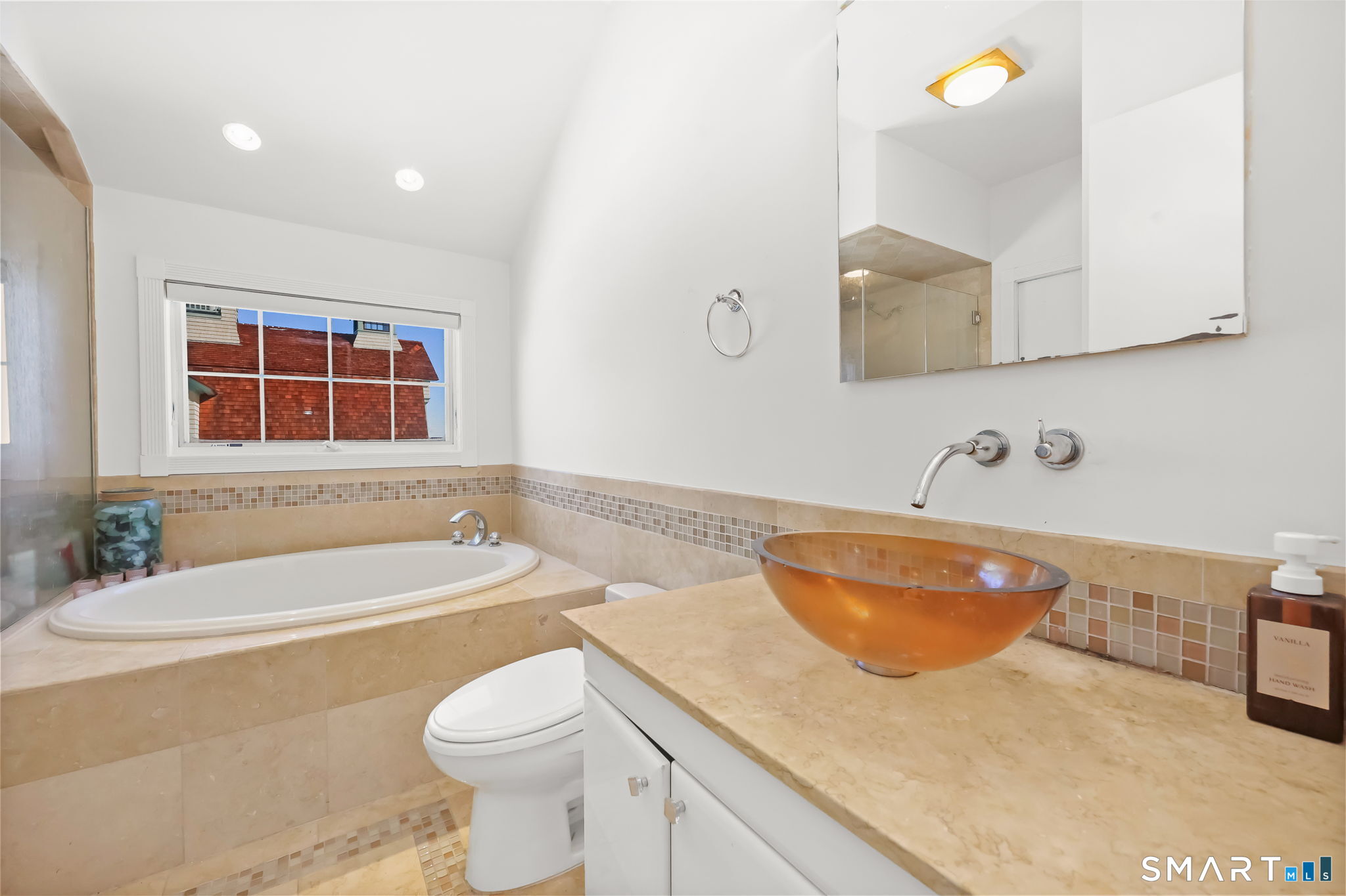 1895 Fairfield Beach Road Fairfield, CT 06824 - Photo 10 of 18 a bathroom with a sink a toilet and bathtub