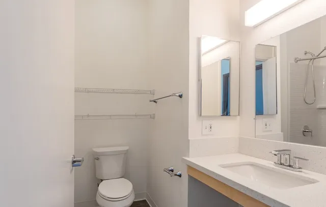 a bathroom with a sink toilet and shower