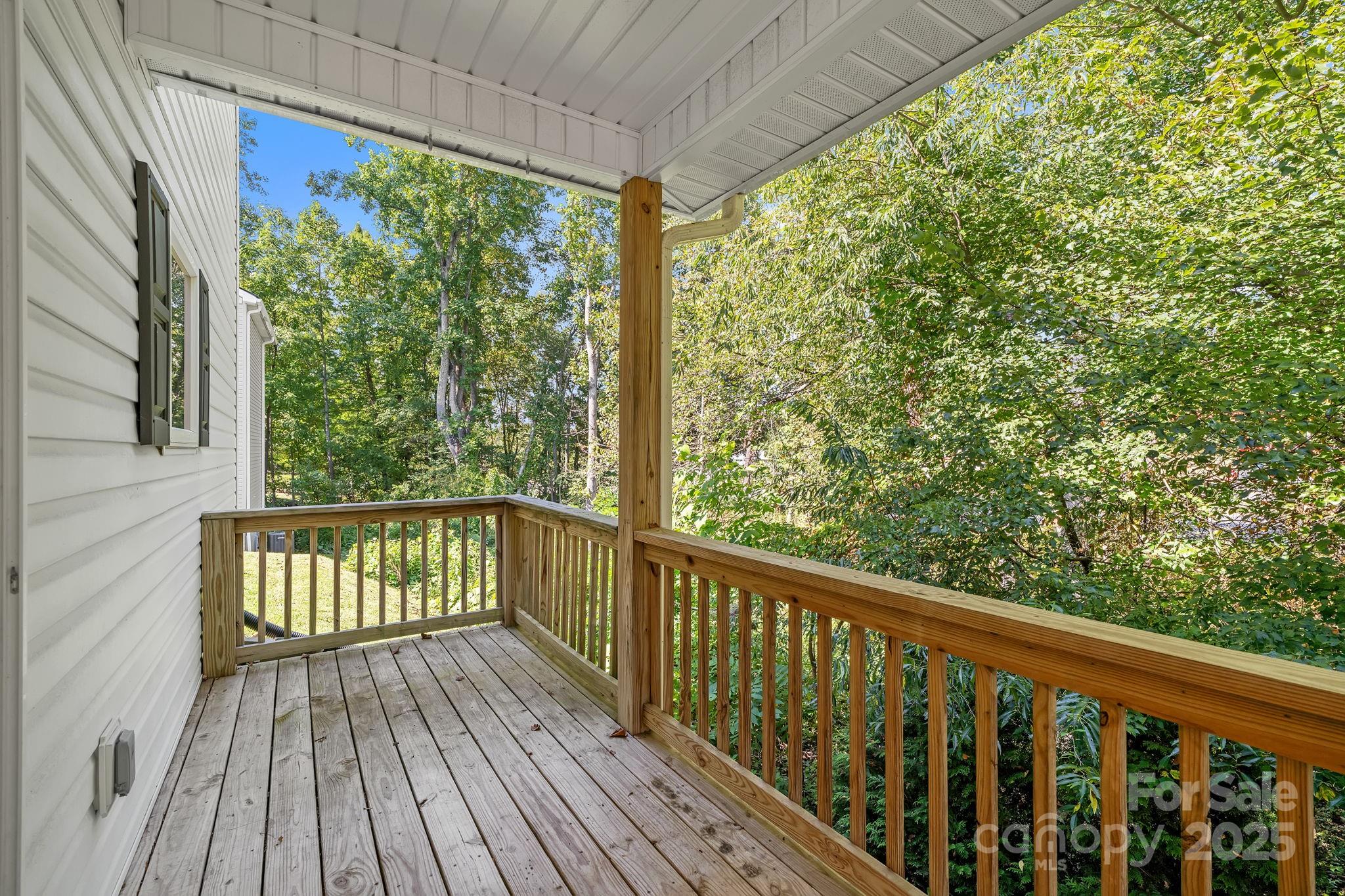 33 English Ivy Road Asheville, NC 28806 - Photo 11 of 27 a view of balcony with wooden floor