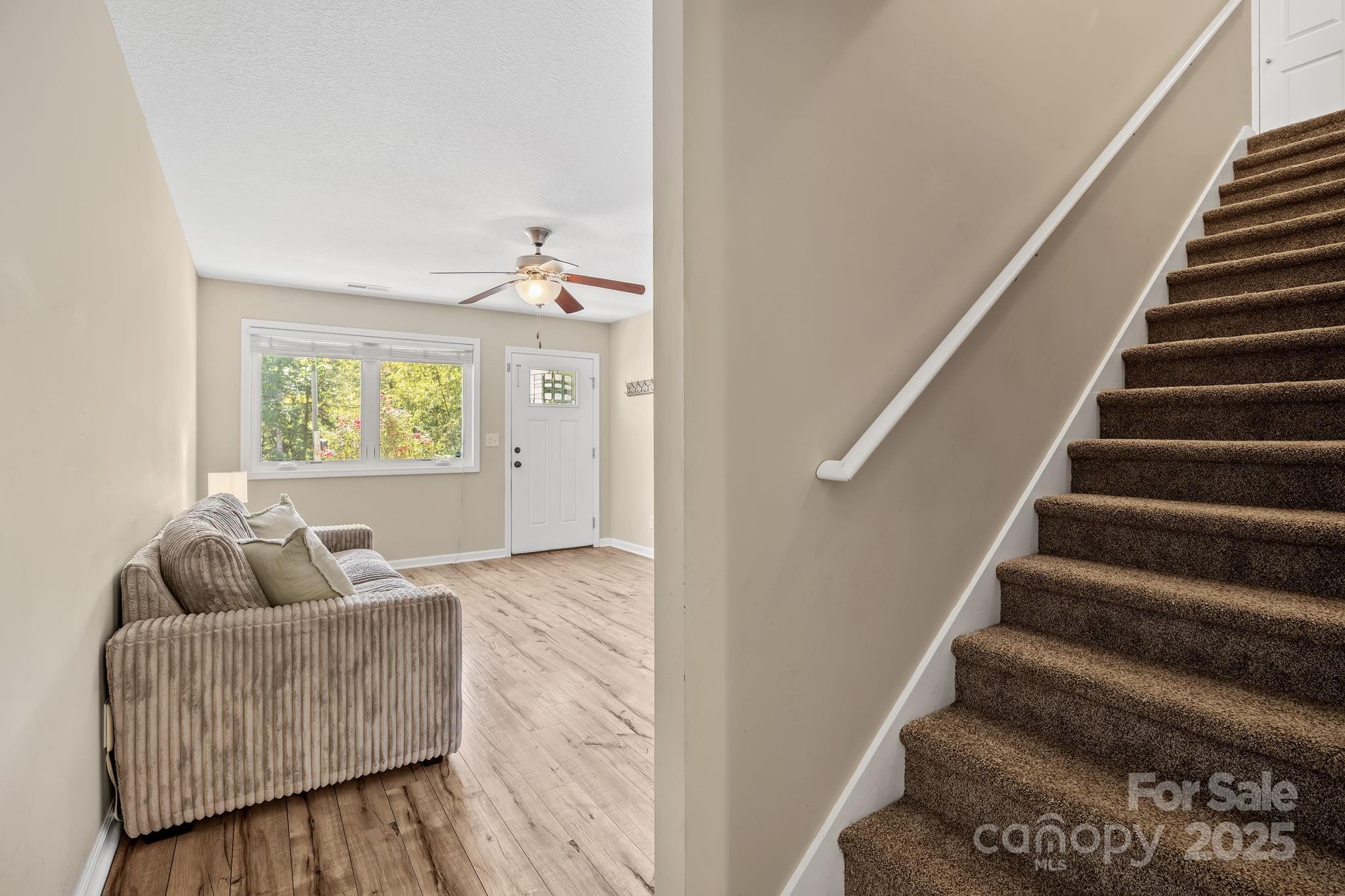 33 English Ivy Road Asheville, NC 28806 - Photo 14 of 27 a living room with furniture and stairs