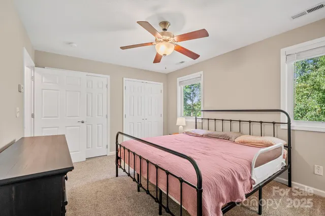 a bedroom with a bed and window