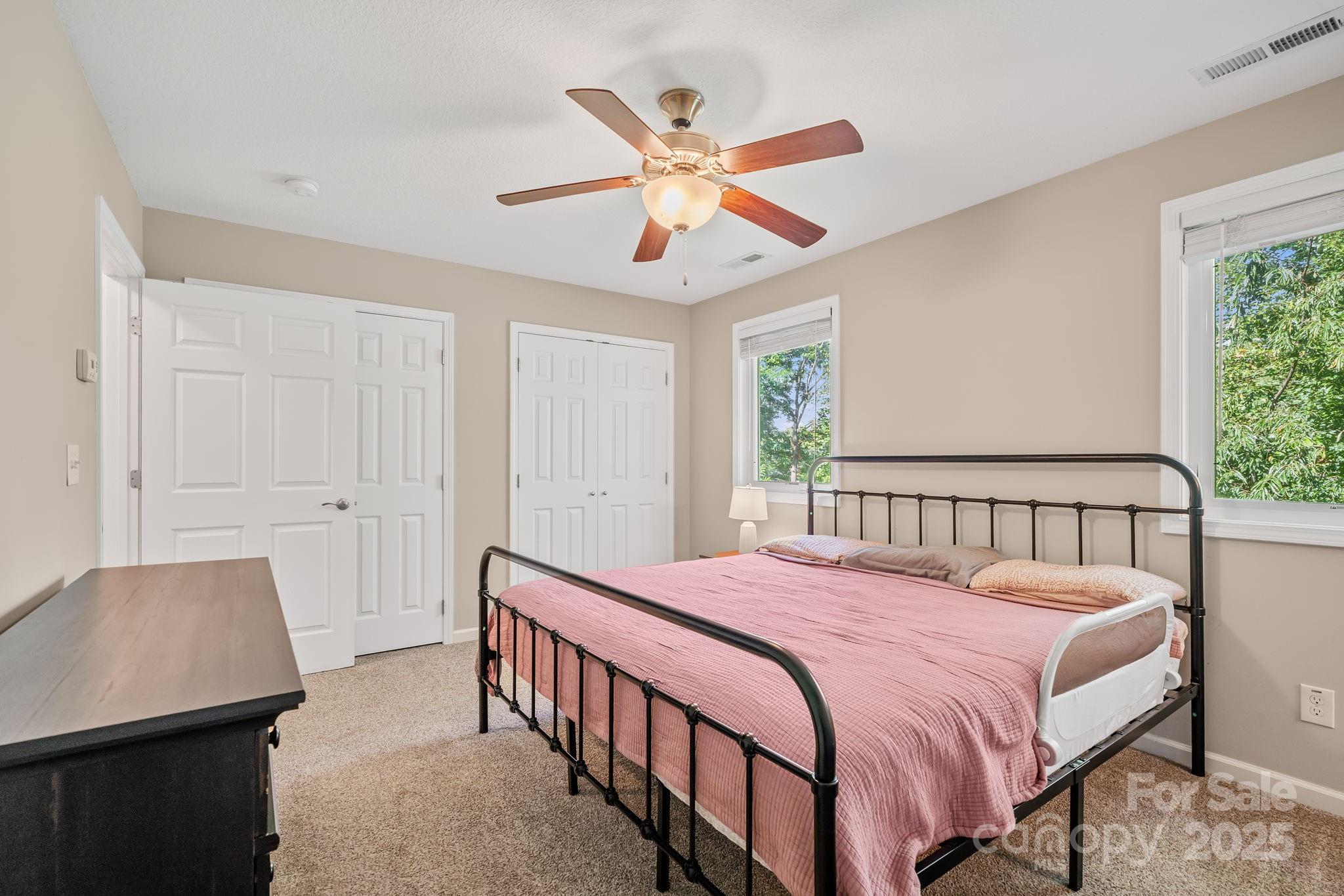 33 English Ivy Road Asheville, NC 28806 - Photo 17 of 27 a bedroom with a bed and window