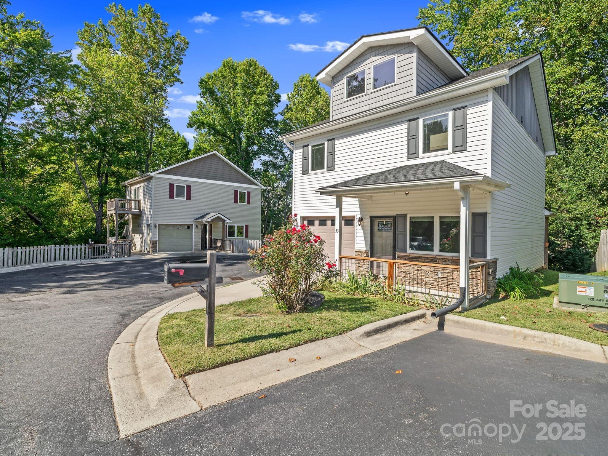 33 English Ivy Road Asheville, NC 28806 - Photo 2 of 27 a front view of a house with a yard
