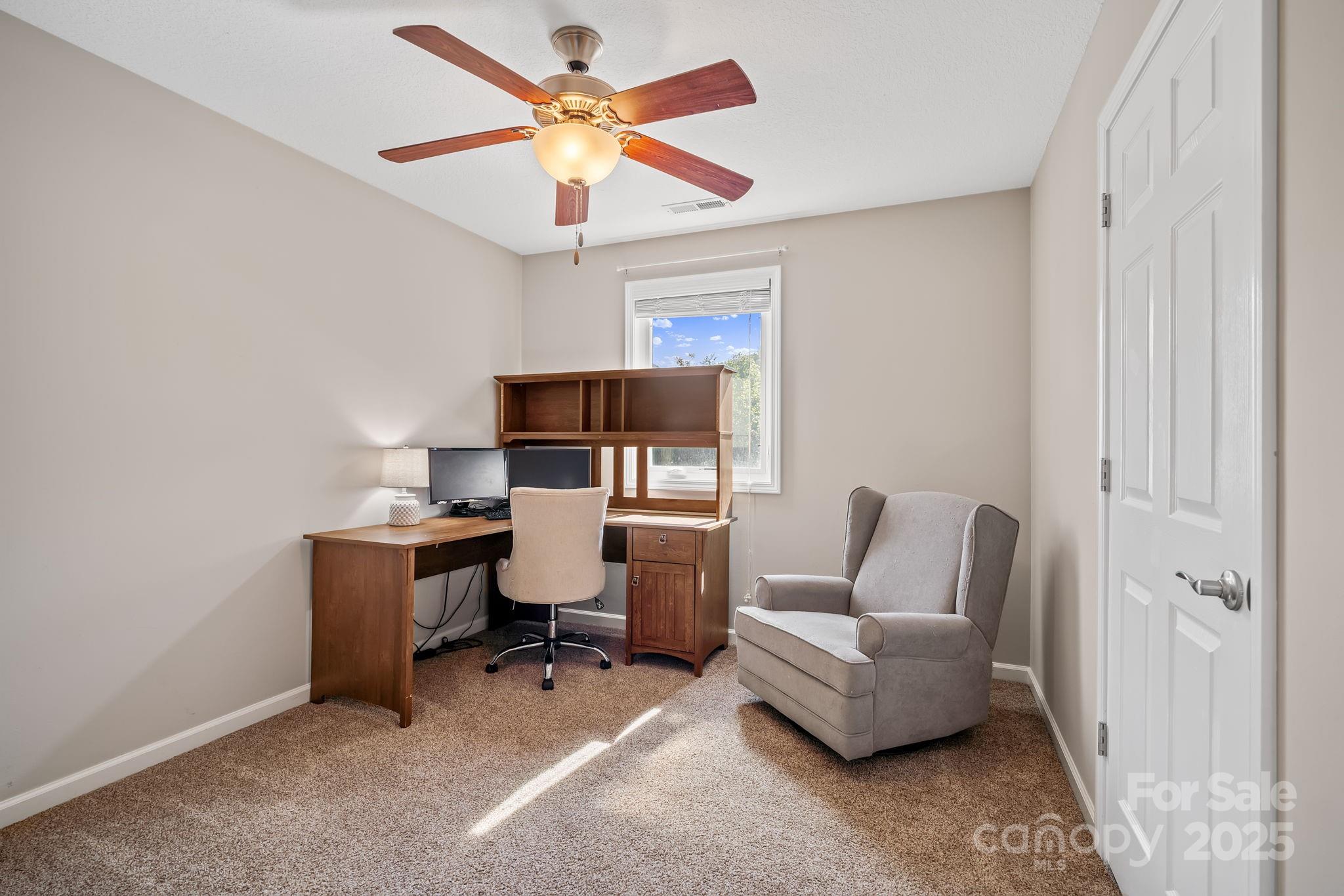 33 English Ivy Road Asheville, NC 28806 - Photo 22 of 27 a living room with furniture and a ceiling fan