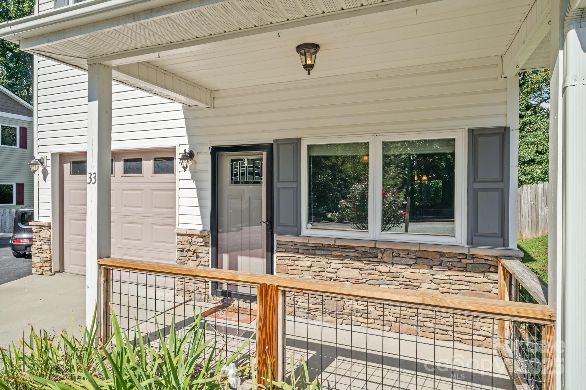 33 English Ivy Road Asheville, NC 28806 - Photo 3 of 27 a view of a house with a large window