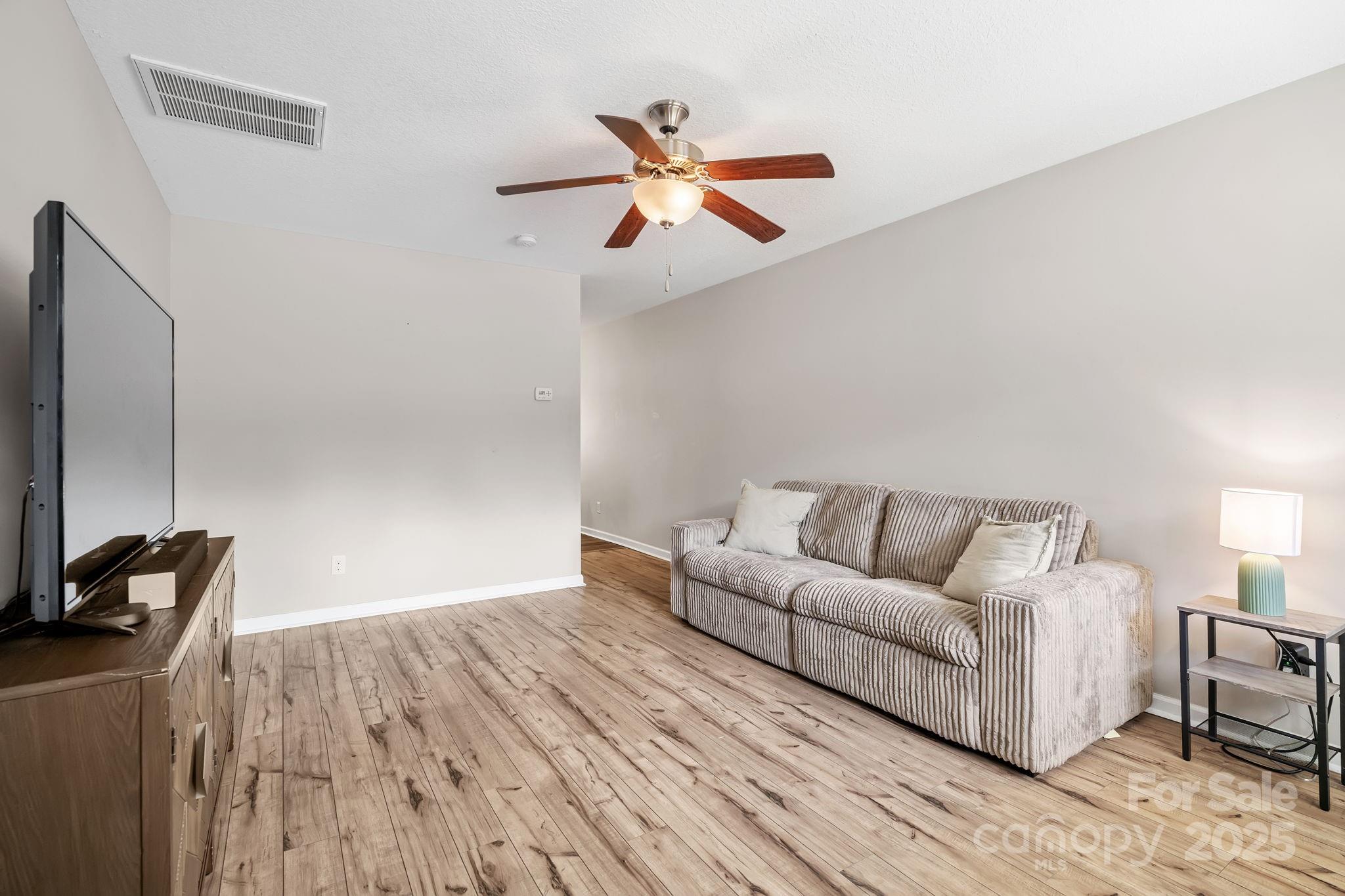 33 English Ivy Road Asheville, NC 28806 - Photo 6 of 27 a living room with furniture and a ceiling fan