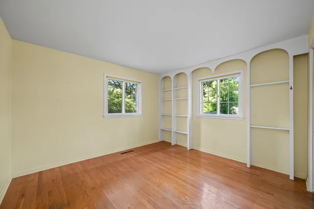 an empty room with windows