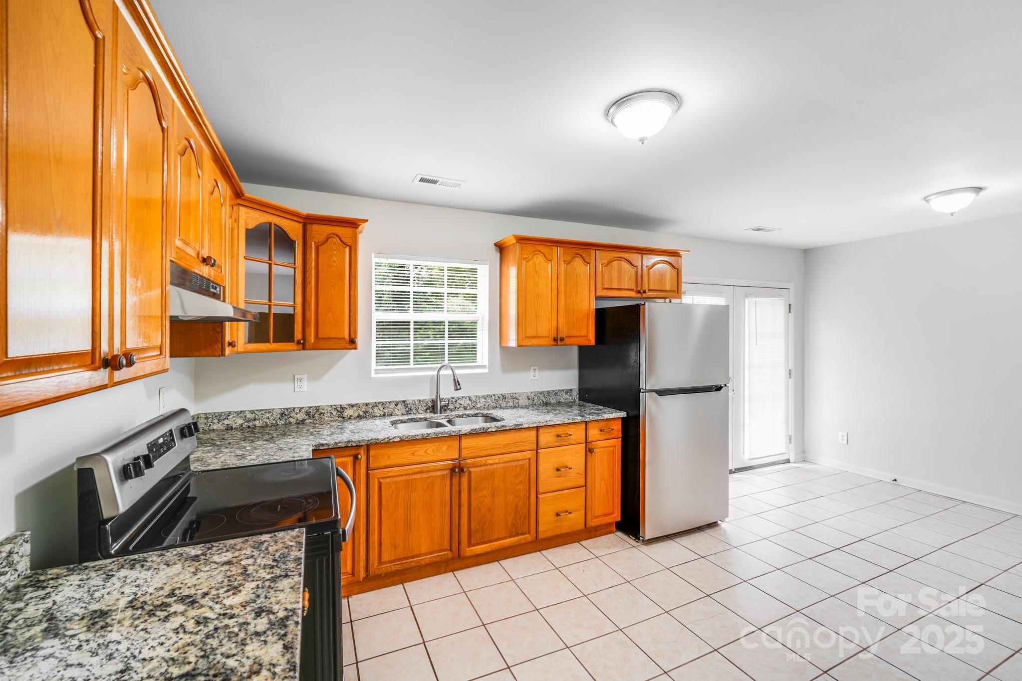 8905 Moores Chapel Road Charlotte, NC 28214 - Photo 11 of 22 a kitchen with stainless steel appliances granite countertop a refrigerator and a sink