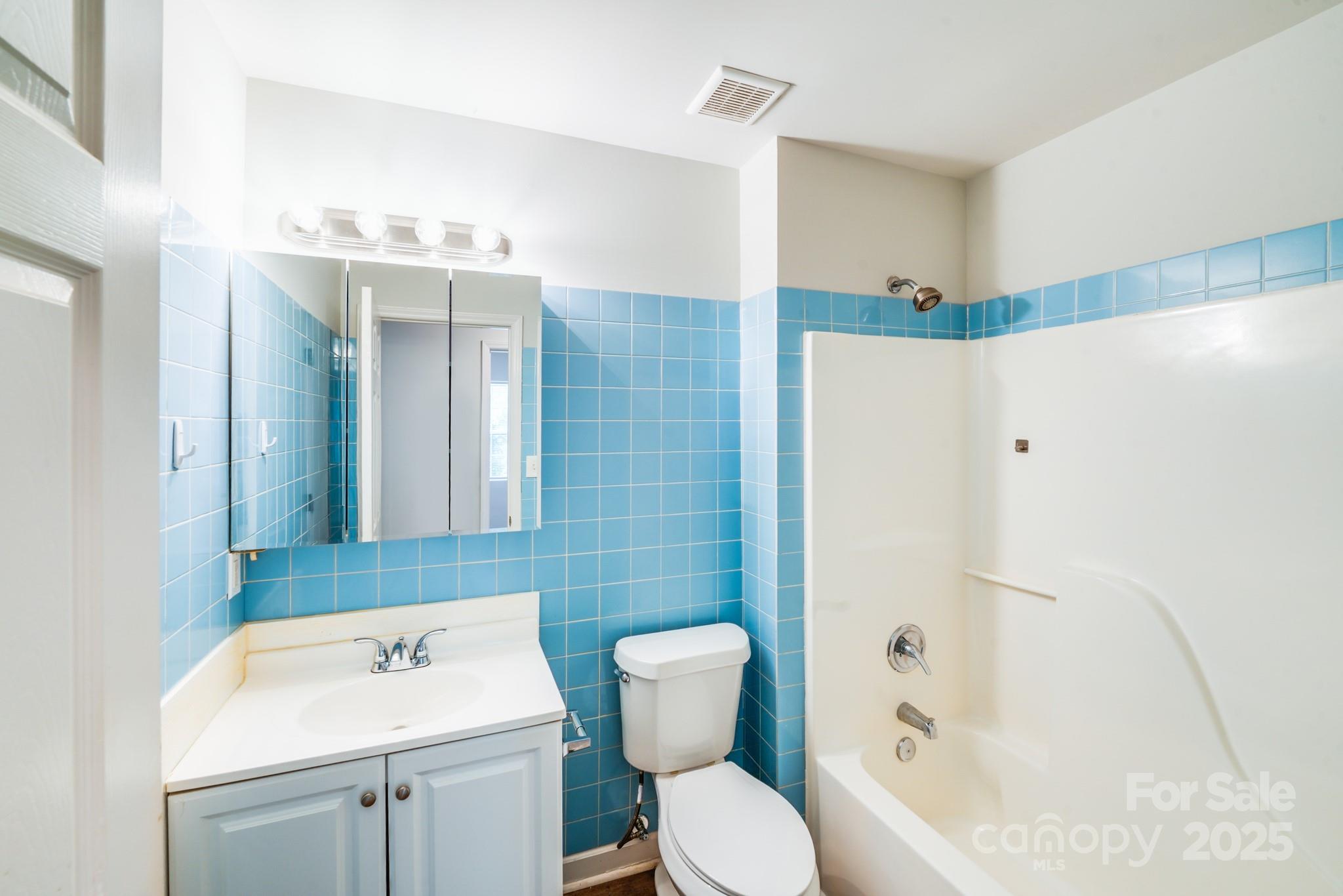 8905 Moores Chapel Road Charlotte, NC 28214 - Photo 12 of 22 a bathroom with a sink toilet and shower