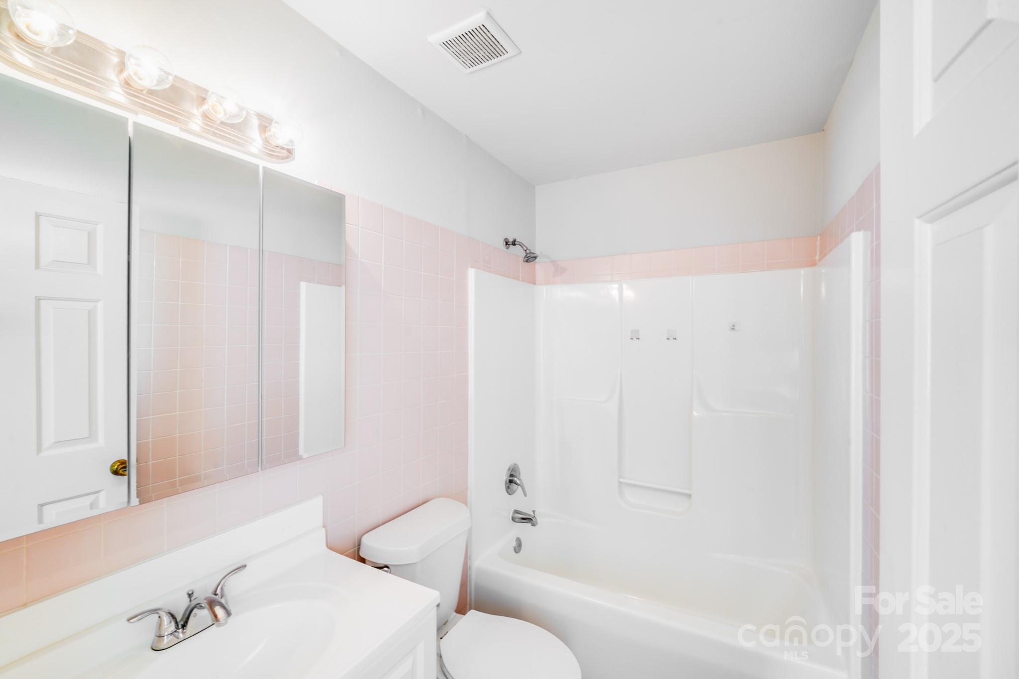 8905 Moores Chapel Road Charlotte, NC 28214 - Photo 14 of 22 a bathroom with a bathtub shower sink and toilet