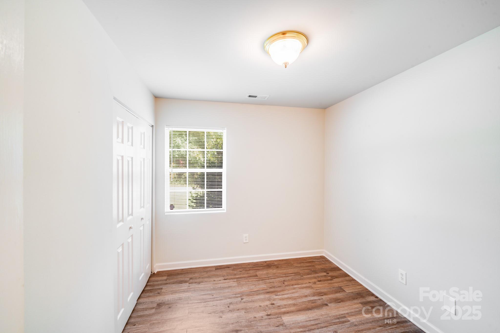 8905 Moores Chapel Road Charlotte, NC 28214 - Photo 17 of 22 an empty room with a window