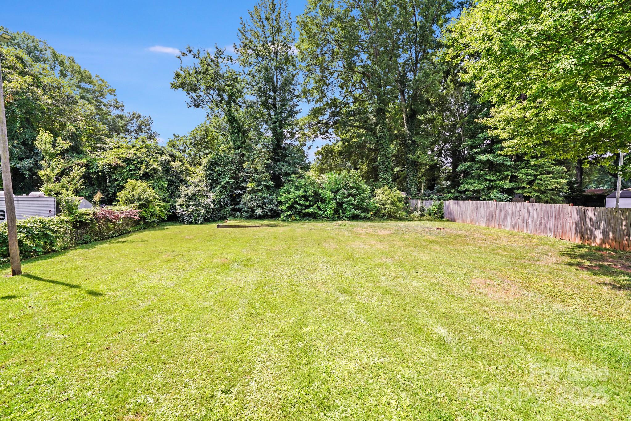 8905 Moores Chapel Road Charlotte, NC 28214 - Photo 19 of 22 a view of a swimming pool with an outdoor space and seating area