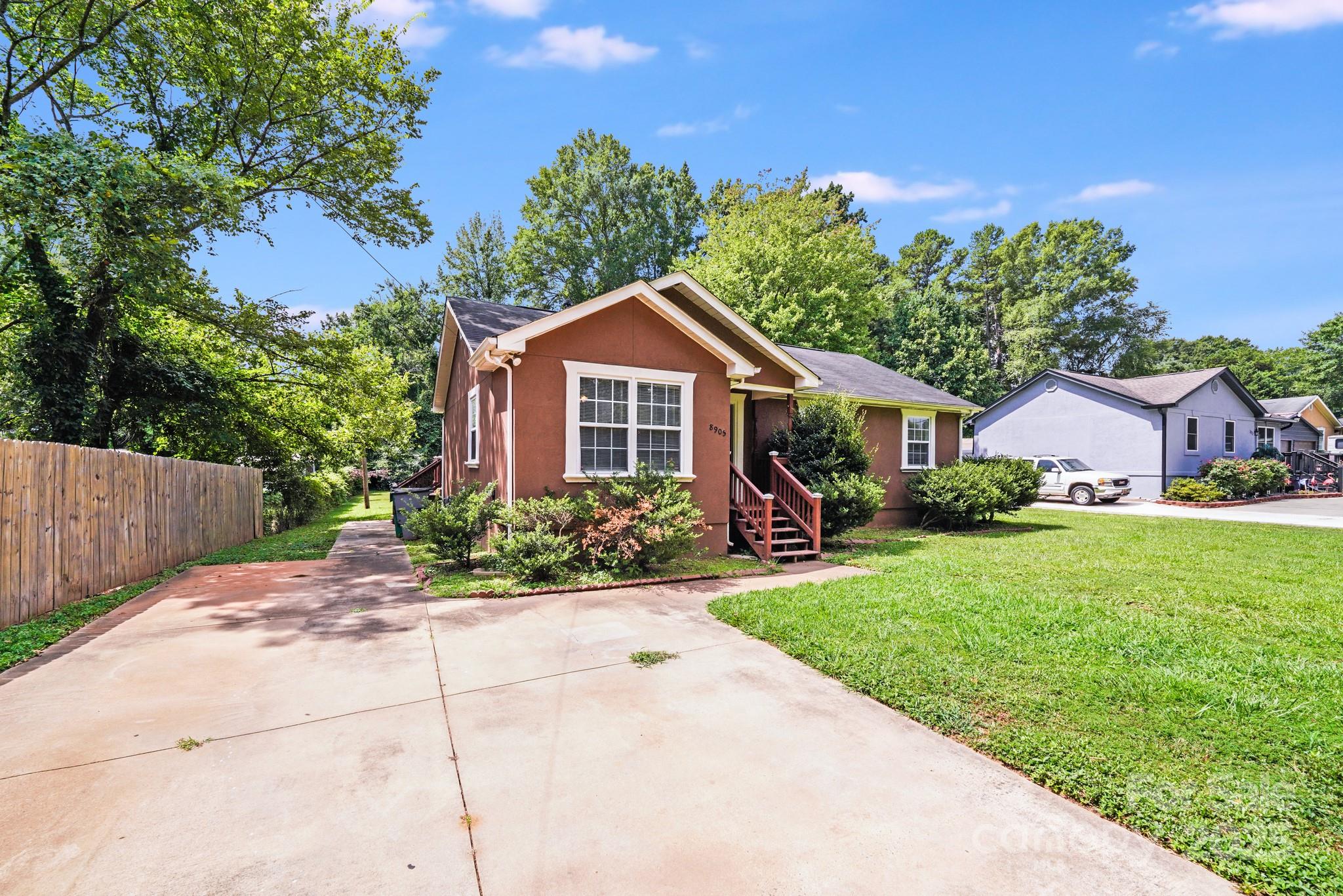 8905 Moores Chapel Road Charlotte, NC 28214 - Photo 21 of 22 a front view of a house with a garden