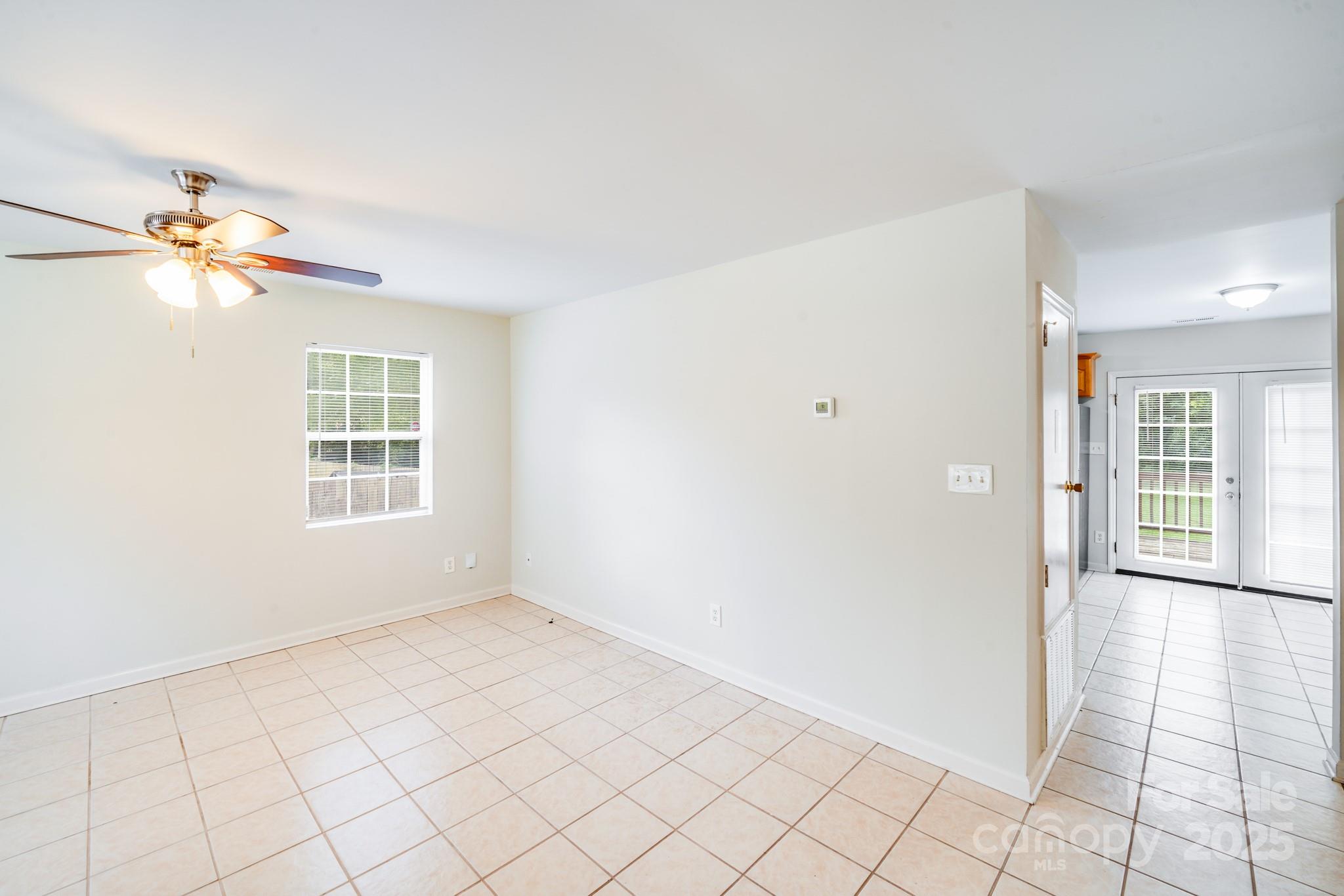 8905 Moores Chapel Road Charlotte, NC 28214 - Photo 7 of 22 a view of an empty room with a window