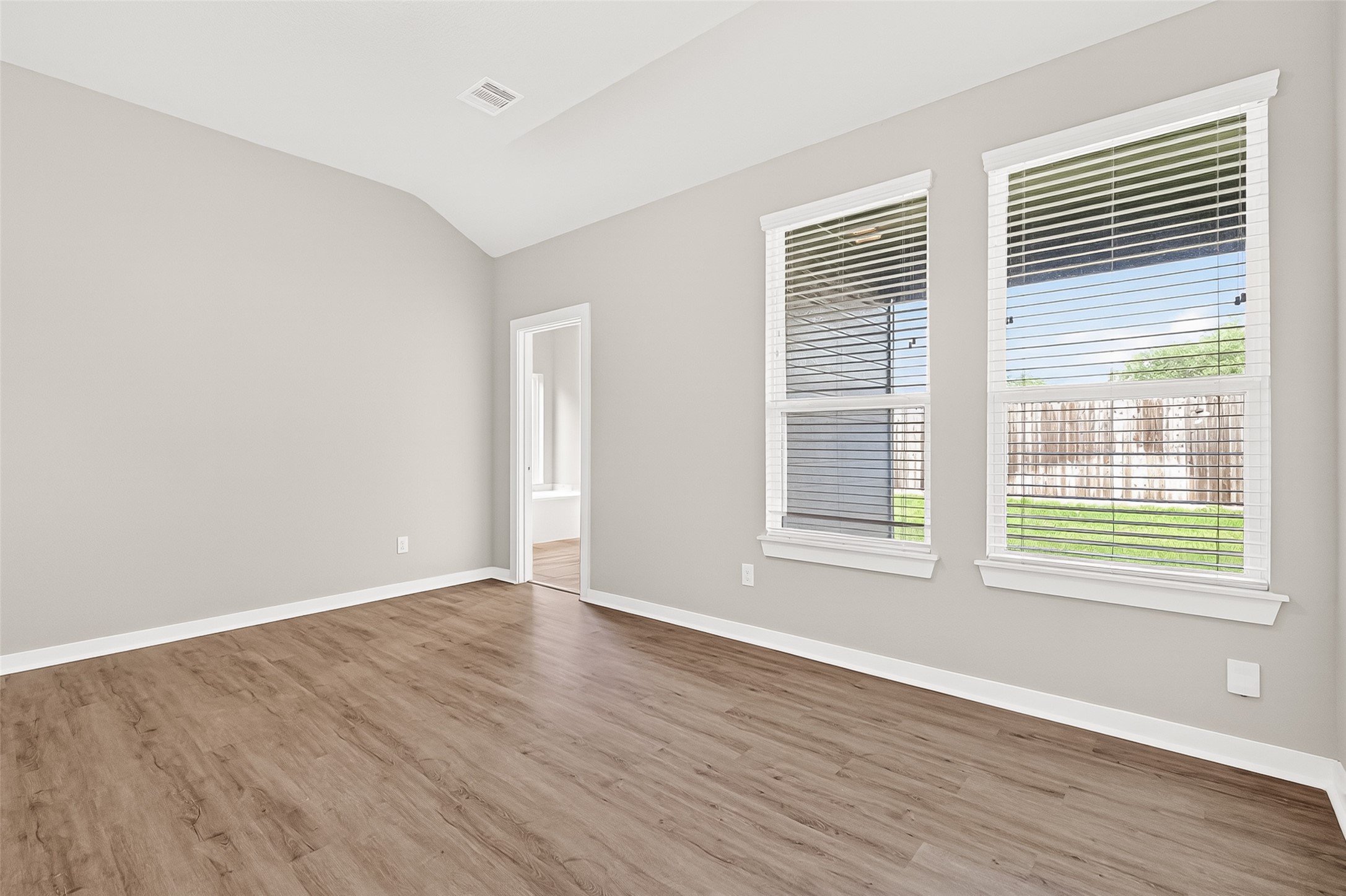 2142 Reed Cave Lane Spring, TX 77386 - Photo 24 of 50 a view of an empty room with wooden floor and a window