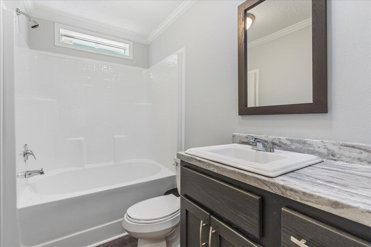 1629 Wasson Road Ten Mile, TN 37880 - Photo 17 of 27 a bathroom with a granite countertop sink toilet and shower