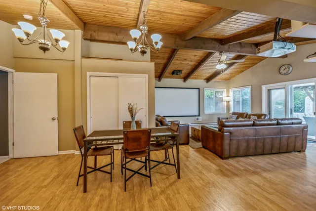 a living room with a couch and wooden floor