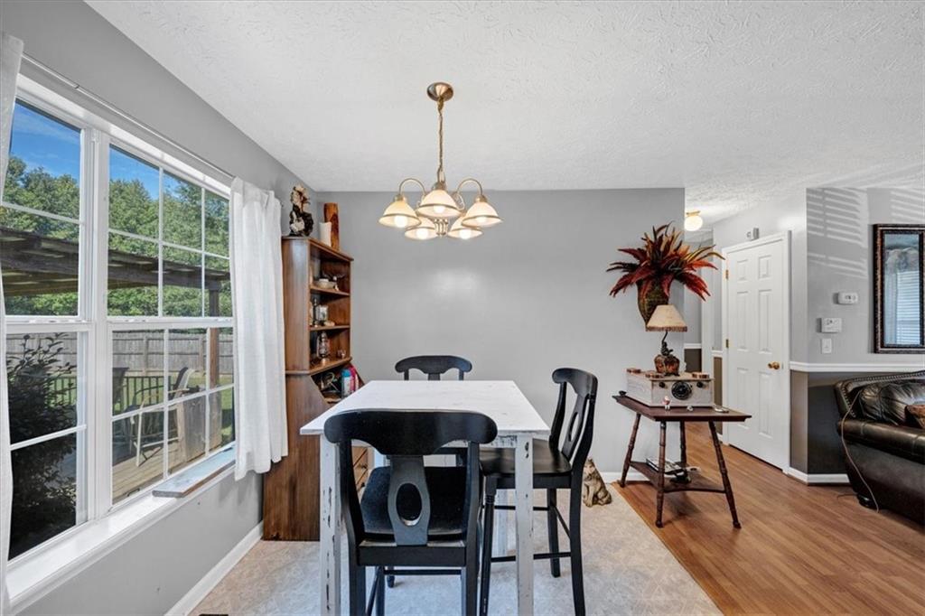 221 Pleasant Way Temple, GA 30179 - Photo 12 of 36 a view of a dining room with furniture window and wooden floor