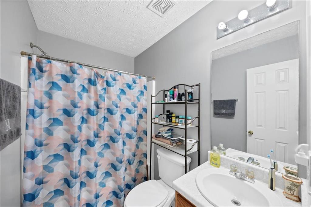 221 Pleasant Way Temple, GA 30179 - Photo 21 of 36 a bathroom with a sink toilet and shower