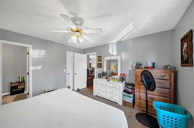 a bedroom with furniture and a chandelier