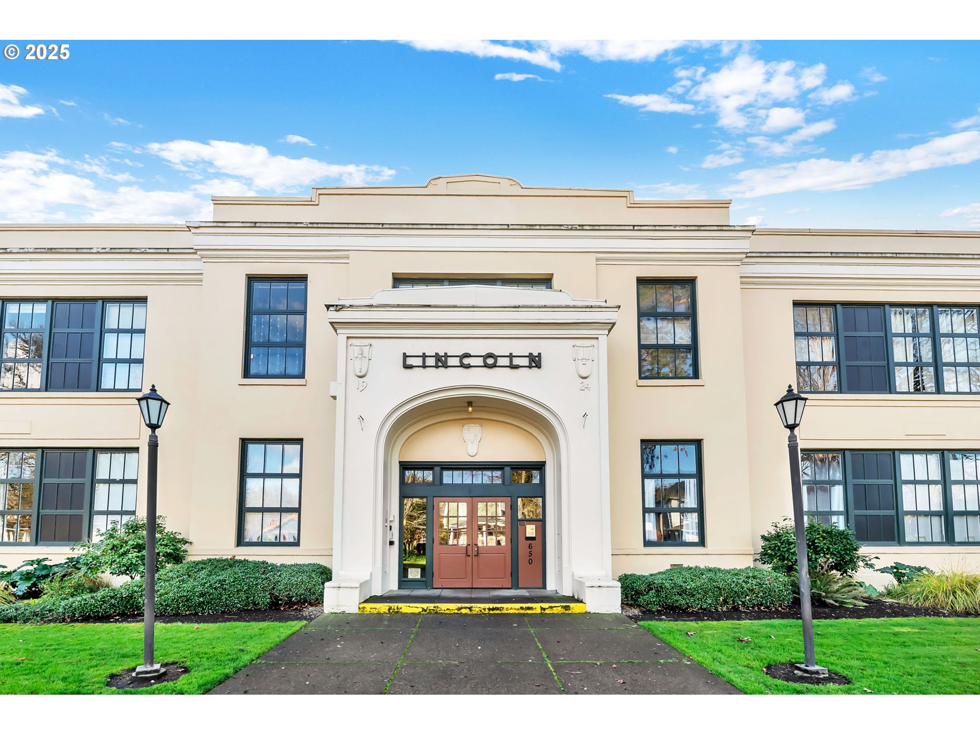 a front view of a house with garden