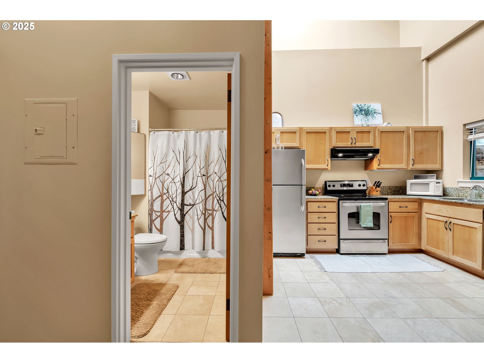 650 West 12th Avenue, Unit 211 Eugene, OR 97402 - Photo 18 of 39 a kitchen with a refrigerator and a stove