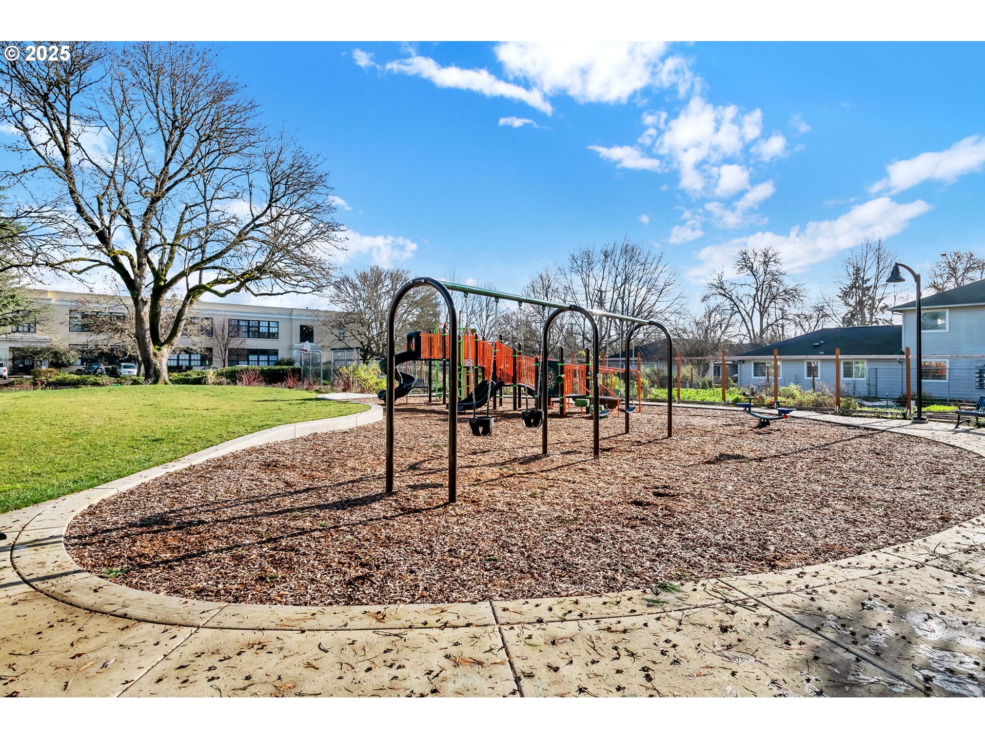 650 West 12th Avenue, Unit 211 Eugene, OR 97402 - Photo 33 of 39 a view of a park with swings and slides