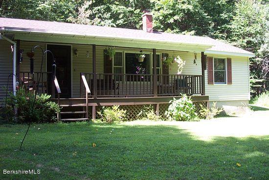 117 Clark Wright Road Middlefield, MA 01050 - Photo 1 of 22 a front view of a house with garden