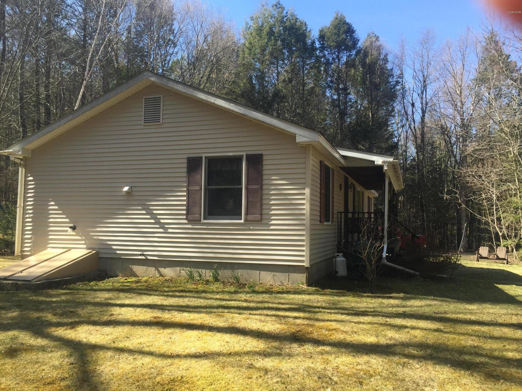 117 Clark Wright Road Middlefield, MA 01050 - Photo 2 of 22 a view of a house with a yard