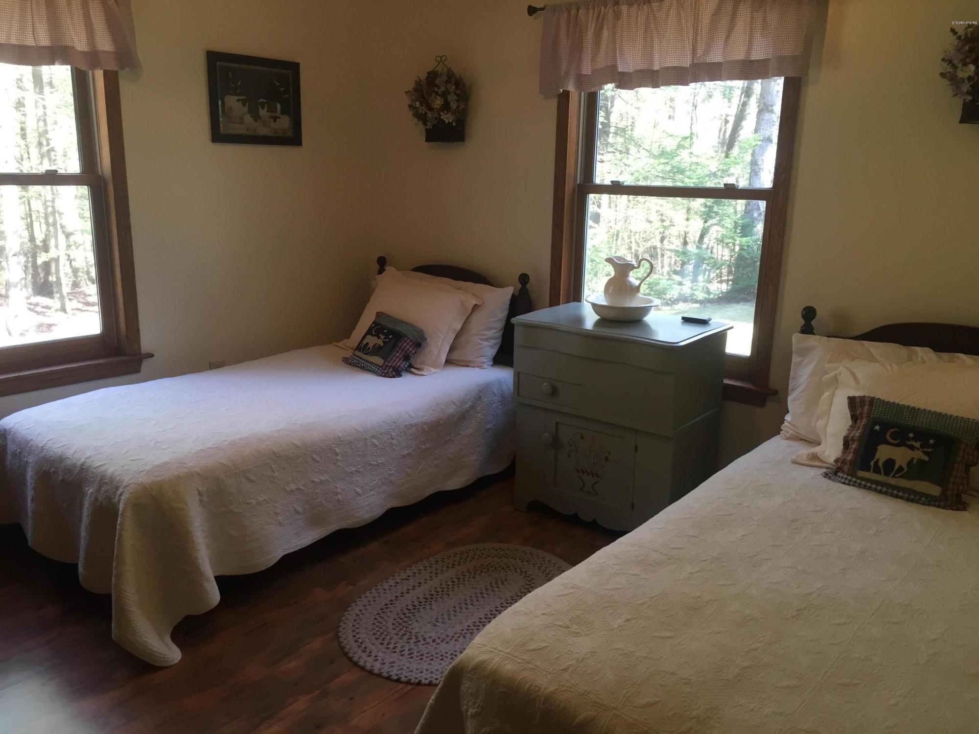 117 Clark Wright Road Middlefield, MA 01050 - Photo 15 of 22 a bedroom with a bed and a window