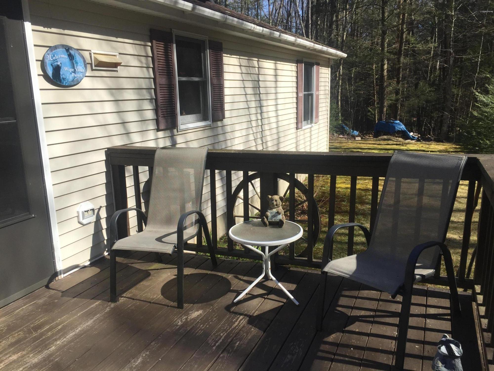117 Clark Wright Road Middlefield, MA 01050 - Photo 5 of 22 a view of a chairs and table in the balcony